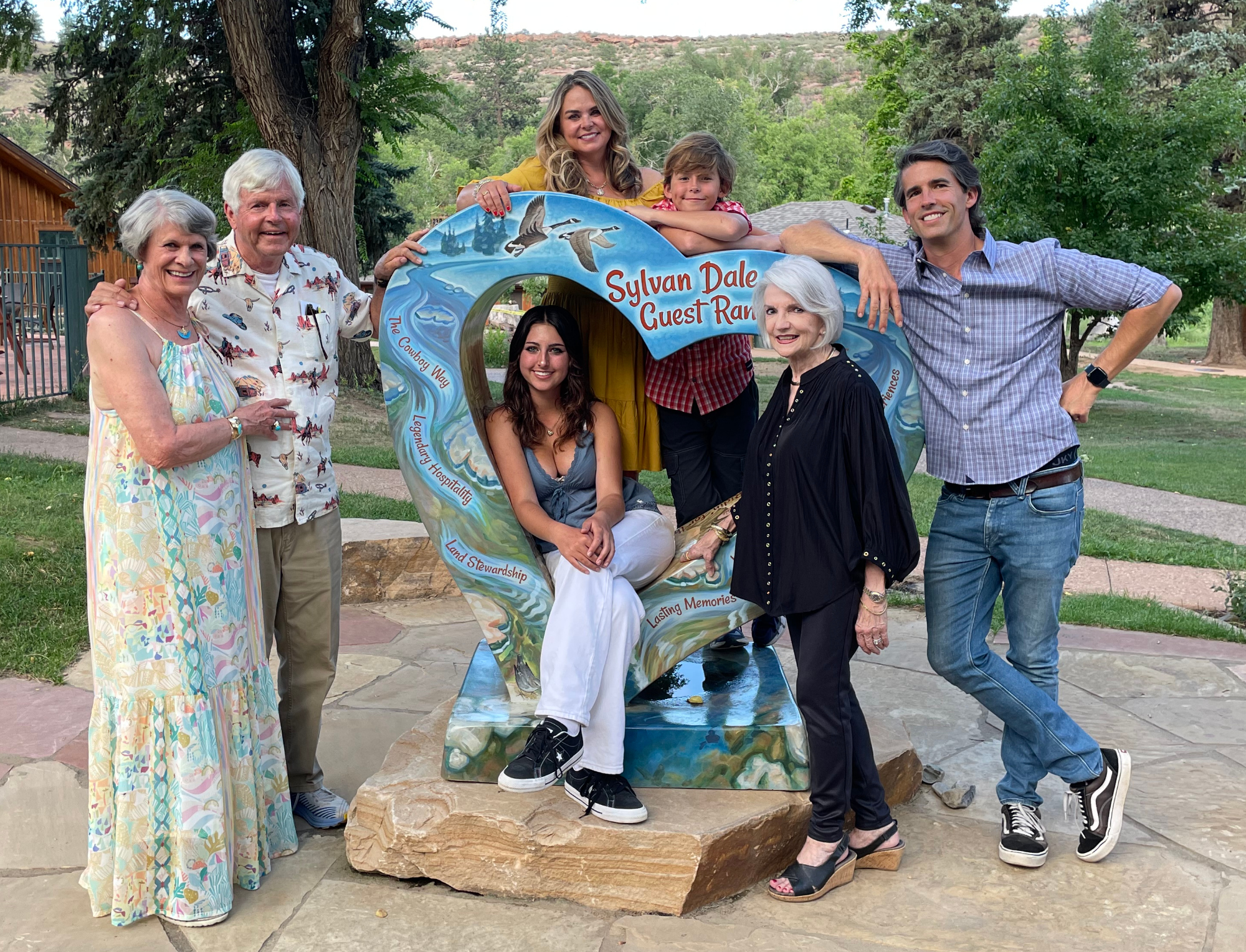 Colorado-raised Heather Hach, back center, with her parents, husband, mother-in-law and two children came home to Colorado for a visit that included a stop at the Sylvan Dale Guest Ranch in Loveland. (COURTESY HEATHER HACH)