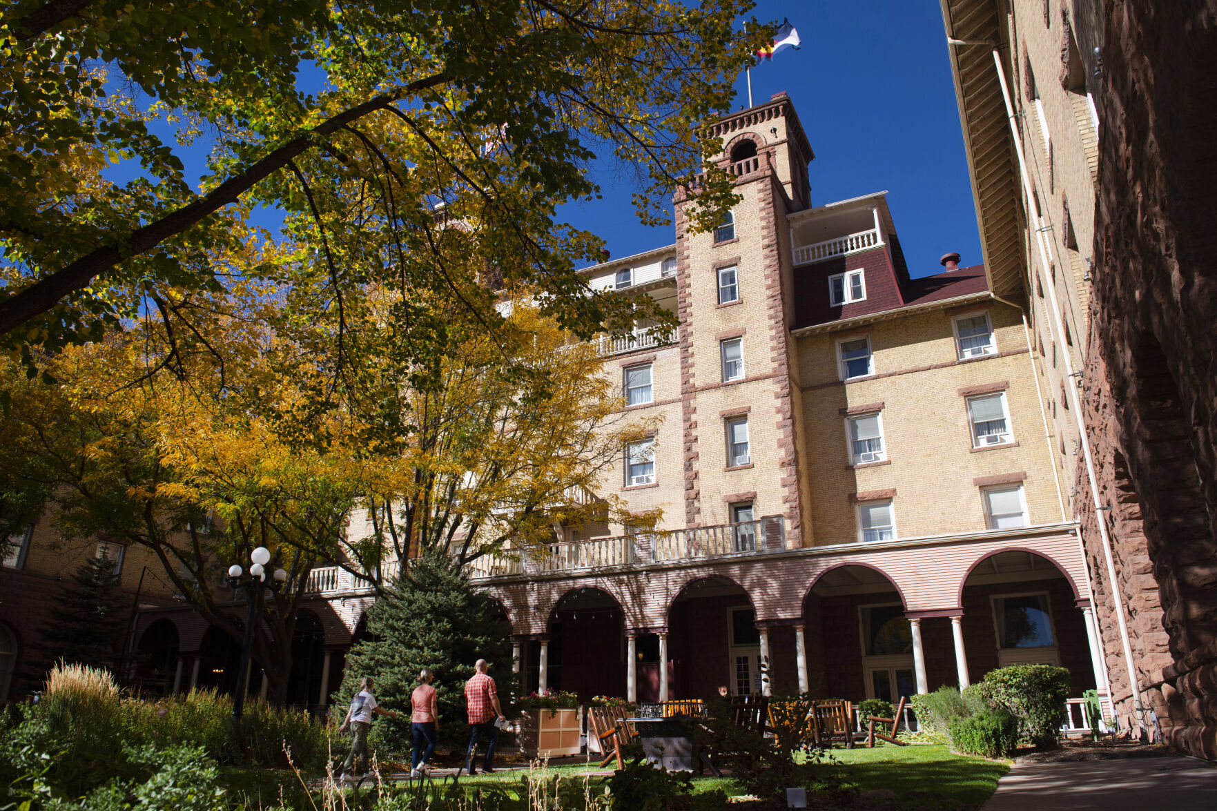 Christian Murdock, The Gazette Visitors walk through the courtyard into the lobby of the Hotel Colorado in Glenwood Springs. The historic hotel opened in 1893. (Christian Murdock, The Gazette)