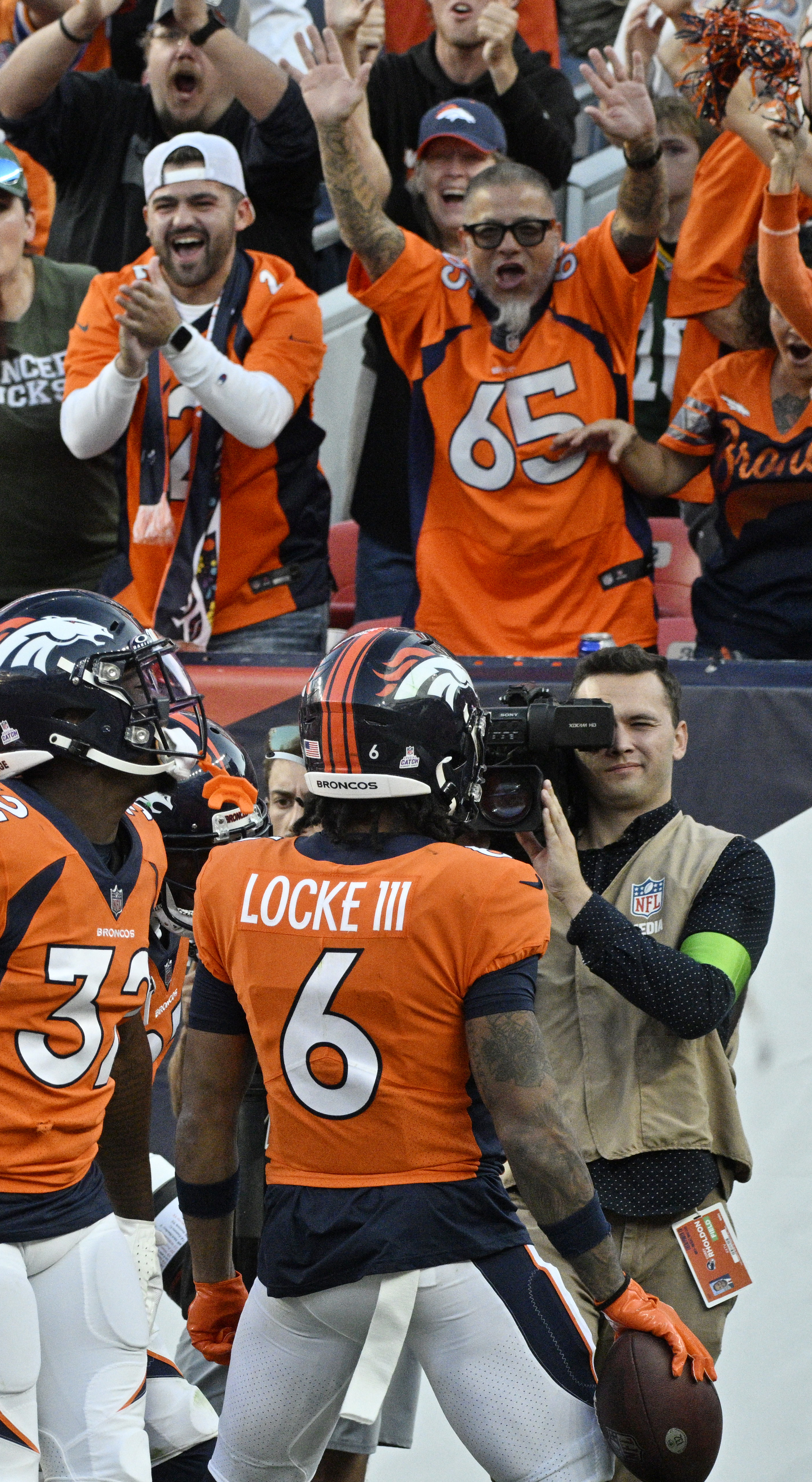 Broncos safety PJ Locke III celebrates with the crowd after making the game winning interception in the 4th quarter of a game at Empower Field at Mile High on Sunday, Oct. 22, 2023. (Photo by Jerilee Bennett, The Gazette)
