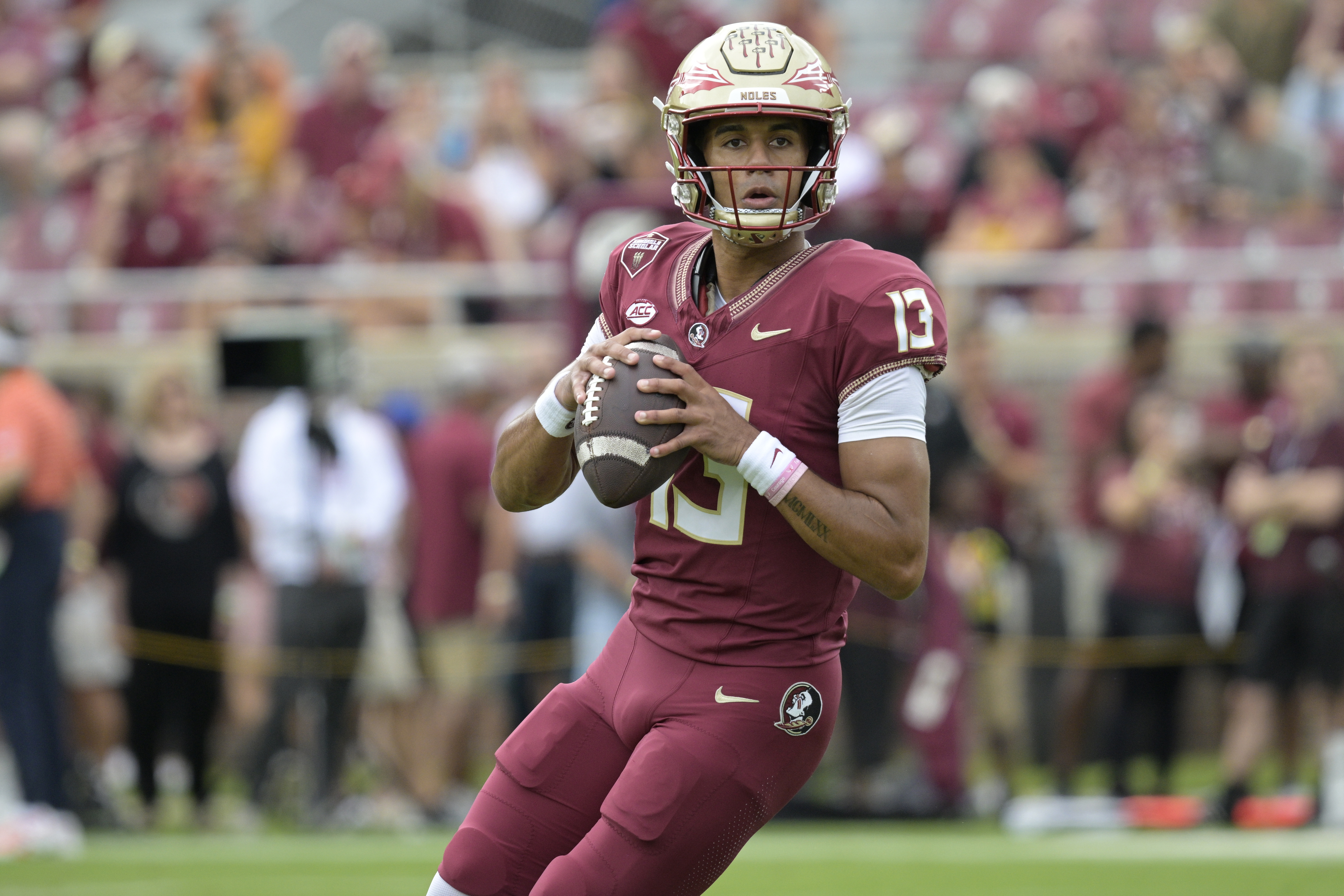 Florida State quarterback Jordan Travis (13) warms up before an NCAA college football game against Syracuse, Saturday, Oct. 14, 2023, in Tallahassee, Fla. (AP Photo/Phelan M. Ebenhack) (Phelan M. Ebenhack)