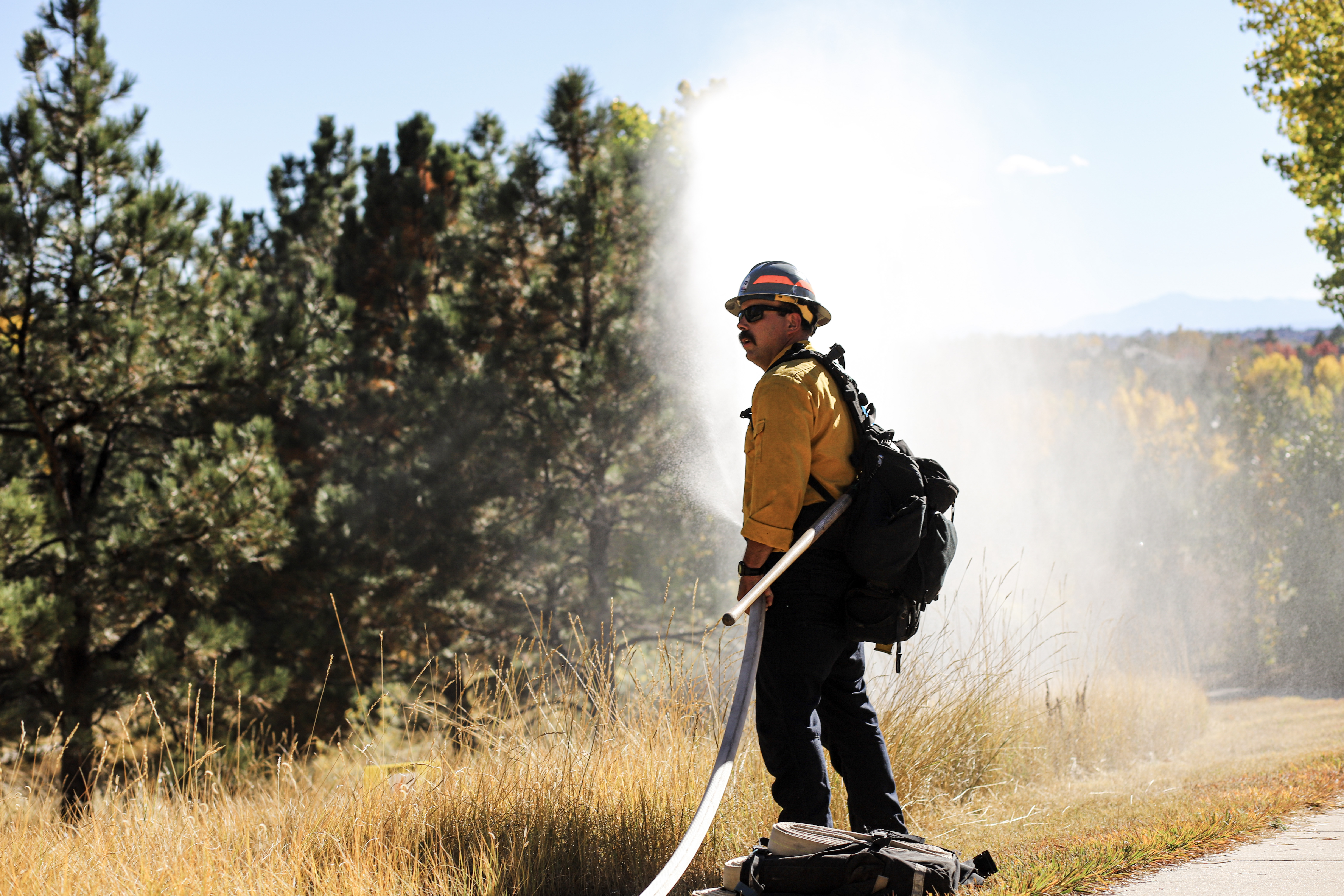A firefighter holds a hose while running an urban wildfire drill in an Aurora neighborhood Tuesday. (KylaPearceAurora reporterkyla.pearce@denvergazette.comhttps://denvergazette.com/content/tncms/avatars/2/16/1e5/2161e54a-3f47-11ed-bc0c-ff41892600ae.4fb8f678b9b96eab286c33c5af828fe7.png)