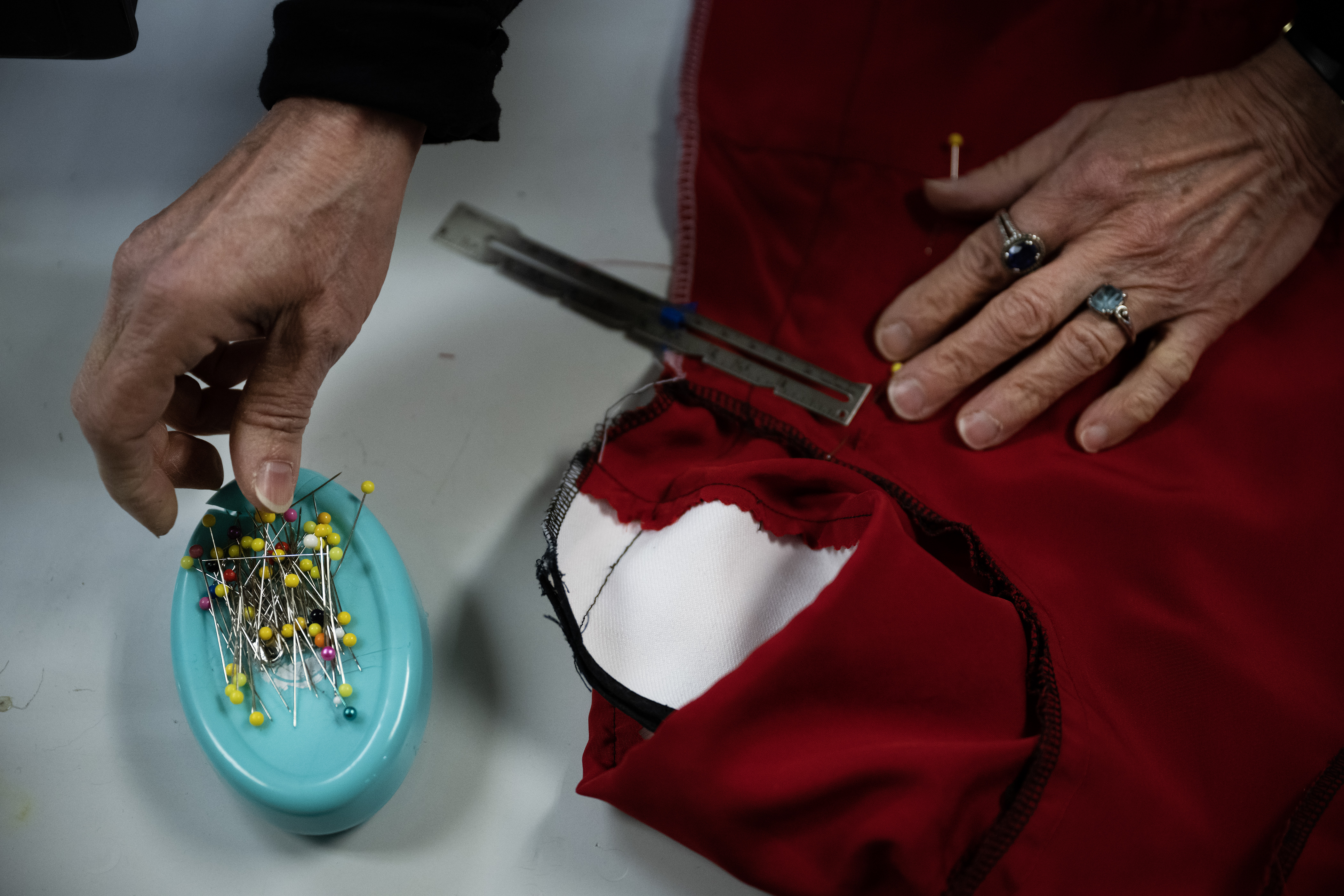Seamstress Marilyn Bauer-Pitts makes adjustments to a costume for a high school production of Annie at Disguises A Costume Superstore on Friday, Oct. 6, 2023, in Lakewood, Colo. (Timothy Hurst/Denver Gazette) (TimHursttim.hurst@gazette.comhttps://secure.gravatar.com/avatar/aca82bd62b4ee425c598527cd6faa1b1?d=mm&r=g)