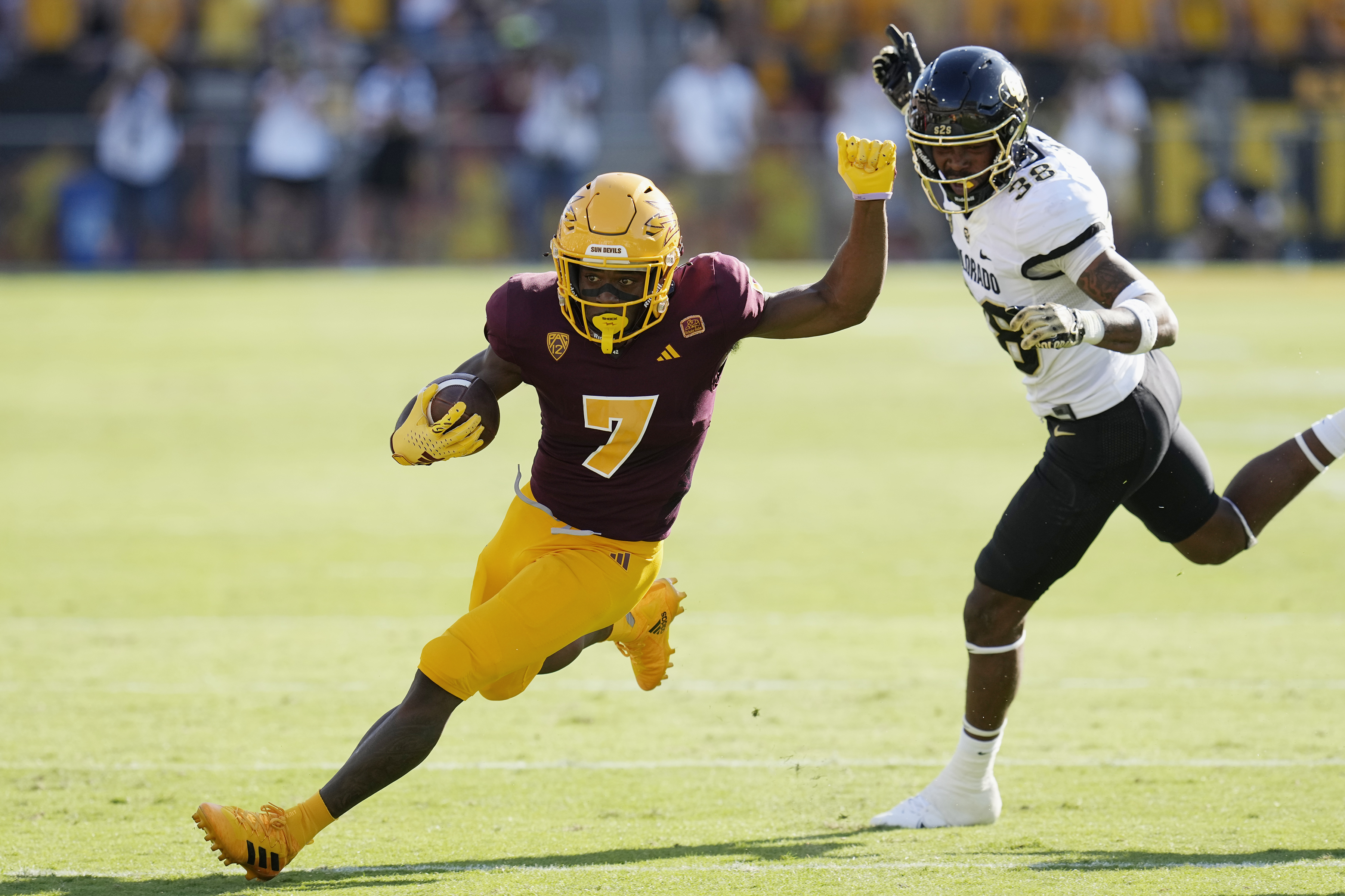 Arizona State wide receiver Melquan Stovall (7) runs past Colorado linebacker Brendan Gant (38) during the first half of an NCAA college football game Saturday, Oct. 7, 2023, in Tempe, Ariz. (AP Photo/Ross D. Franklin) (Ross D. Franklin)