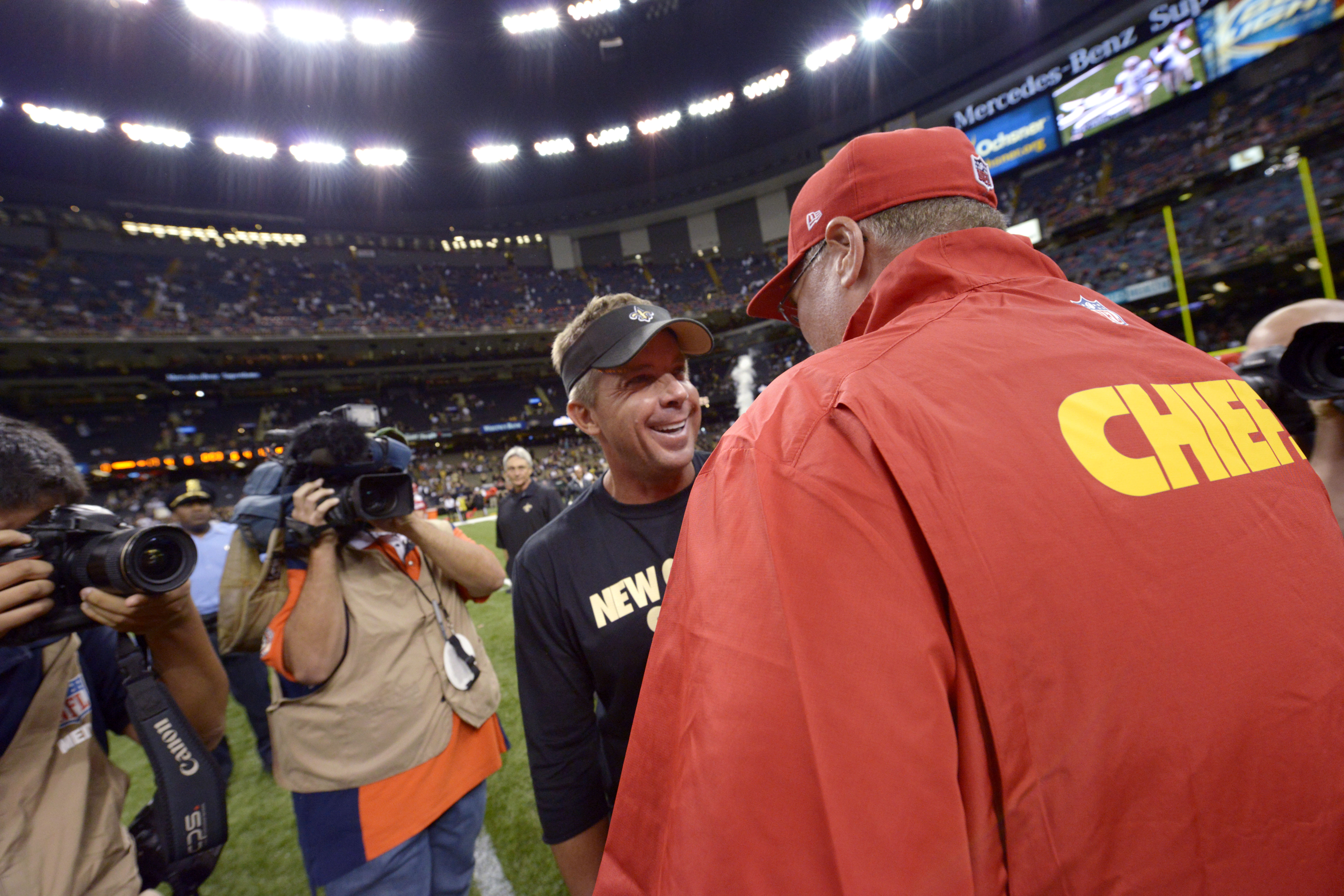 Kansas City Chiefs coach Andy Reid, right, talks with New Orleans Saints coach Sean Payton after an NFL preseason football game at the Superdome in New Orleans, Friday, Aug. 9, 2013. It was Payton's first game back since his year-long suspension by the league. (AP Photo/Matthew Hinton) (Matthew Hinton)