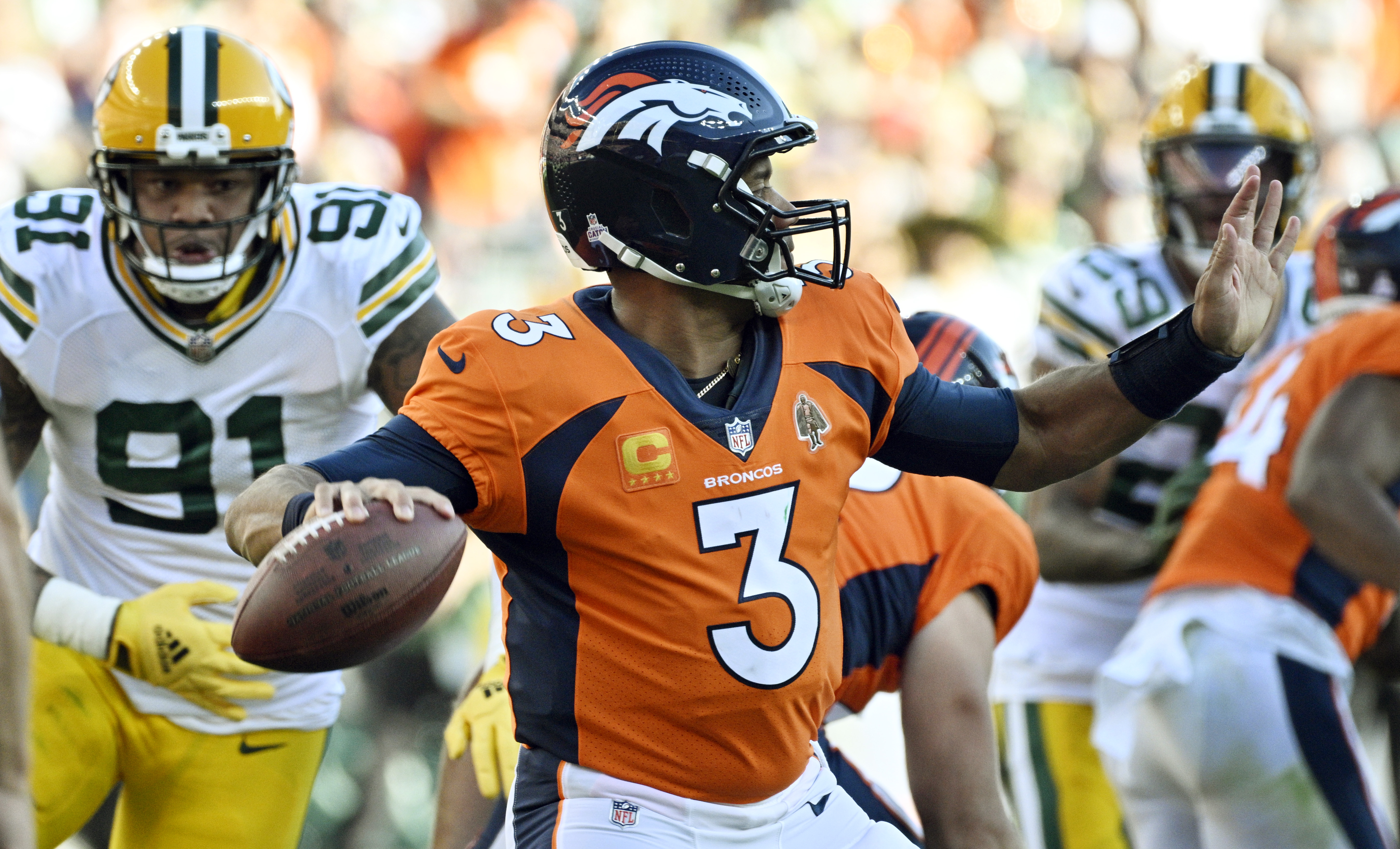 Broncos quarterback Russell Wilson looks to his left to throw the ball during a game at Empower Field at Mile High on Sunday, Oct. 22,. 2023. (Photo by Jerilee Bennett, The Gazette)