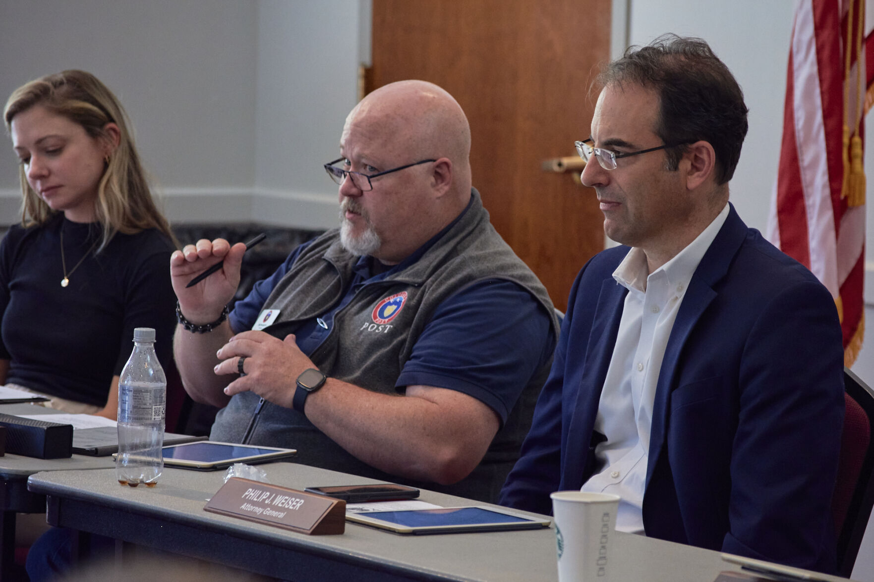 Erik Bourgerie (left) is the director of The Colorado Peace Officer Standards and Training (POST) board, the state agency responsible for regulating police, which is chaired by Attorney General Phil Weiser (right). The 24-member board is made up of largely of law enforcement officials. POST has 16 staff members. (Photo by Andrew Fraieli) (Photo by Andrew Fraieli)