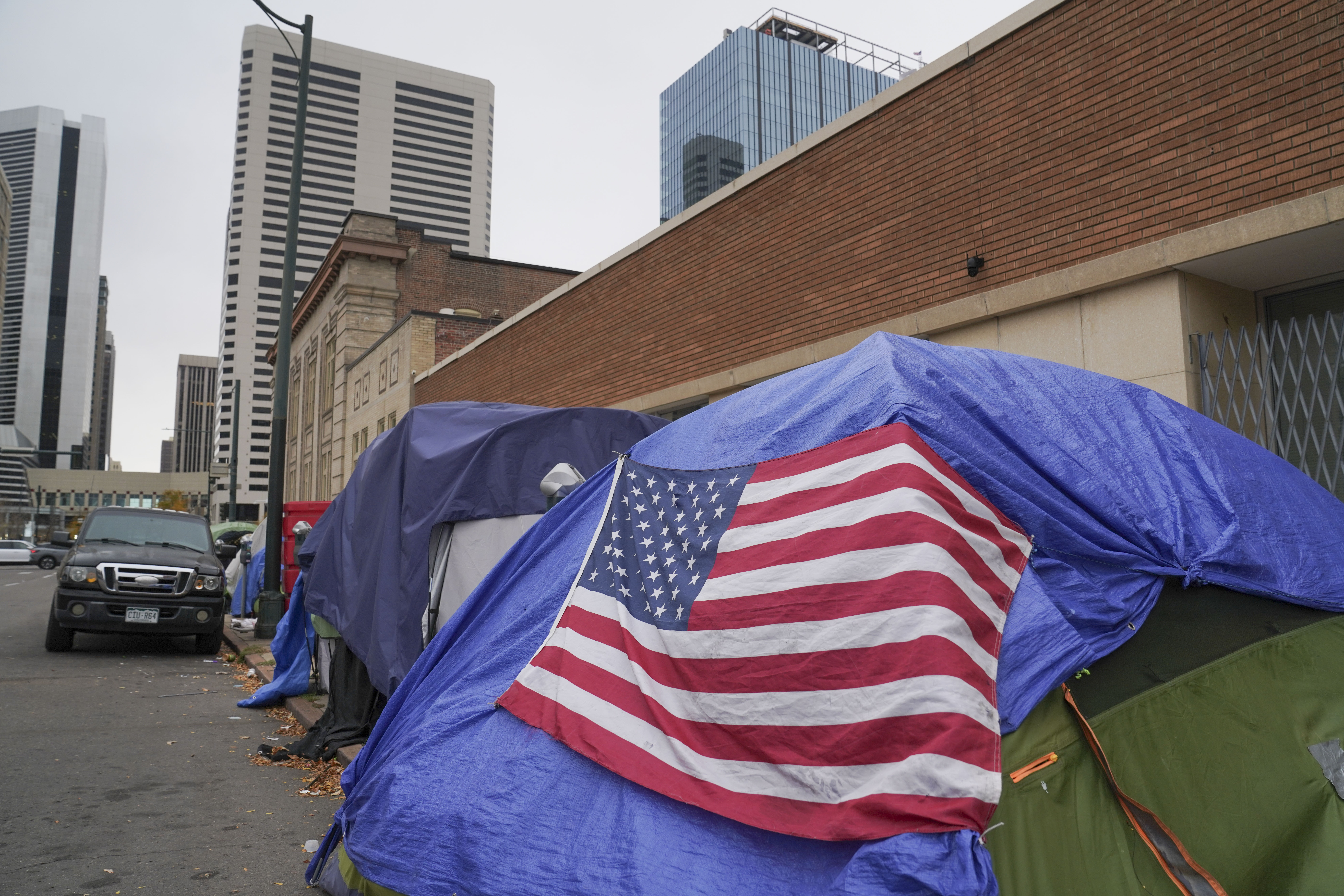 Tents line the sidewalks near 21st and Curtis Street on Thursday, Oct. 26, 2023 in Denver, Colorado. Some 50 homeless people at the encampment are being offered hotel housing as cold weather approaches, according to the mayor’s office. The city is planning to sweep the encampment. (PHOTO: Rebecca Slezak/Special to The Denver Gazette) (Rebecca Slezak)