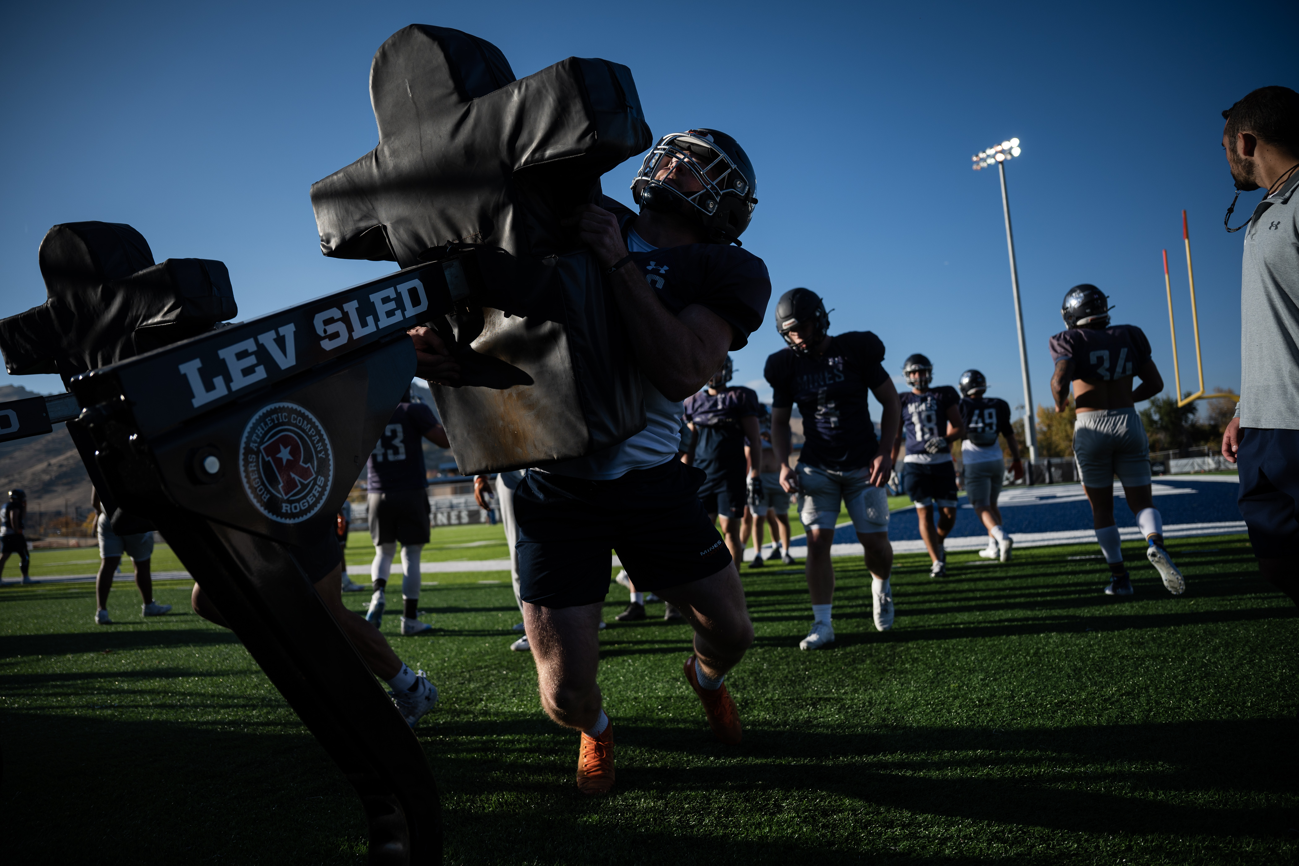 Colorado School of Mines linebackers hit the tackle sled during a practice on Wednesday, Oct. 25, 2023, at Marv Kay Stadium in Golden, Colo. (Timothy Hurst/Denver Gazette) (TimHursttim.hurst@gazette.comhttps://secure.gravatar.com/avatar/aca82bd62b4ee425c598527cd6faa1b1?d=mm&r=g)