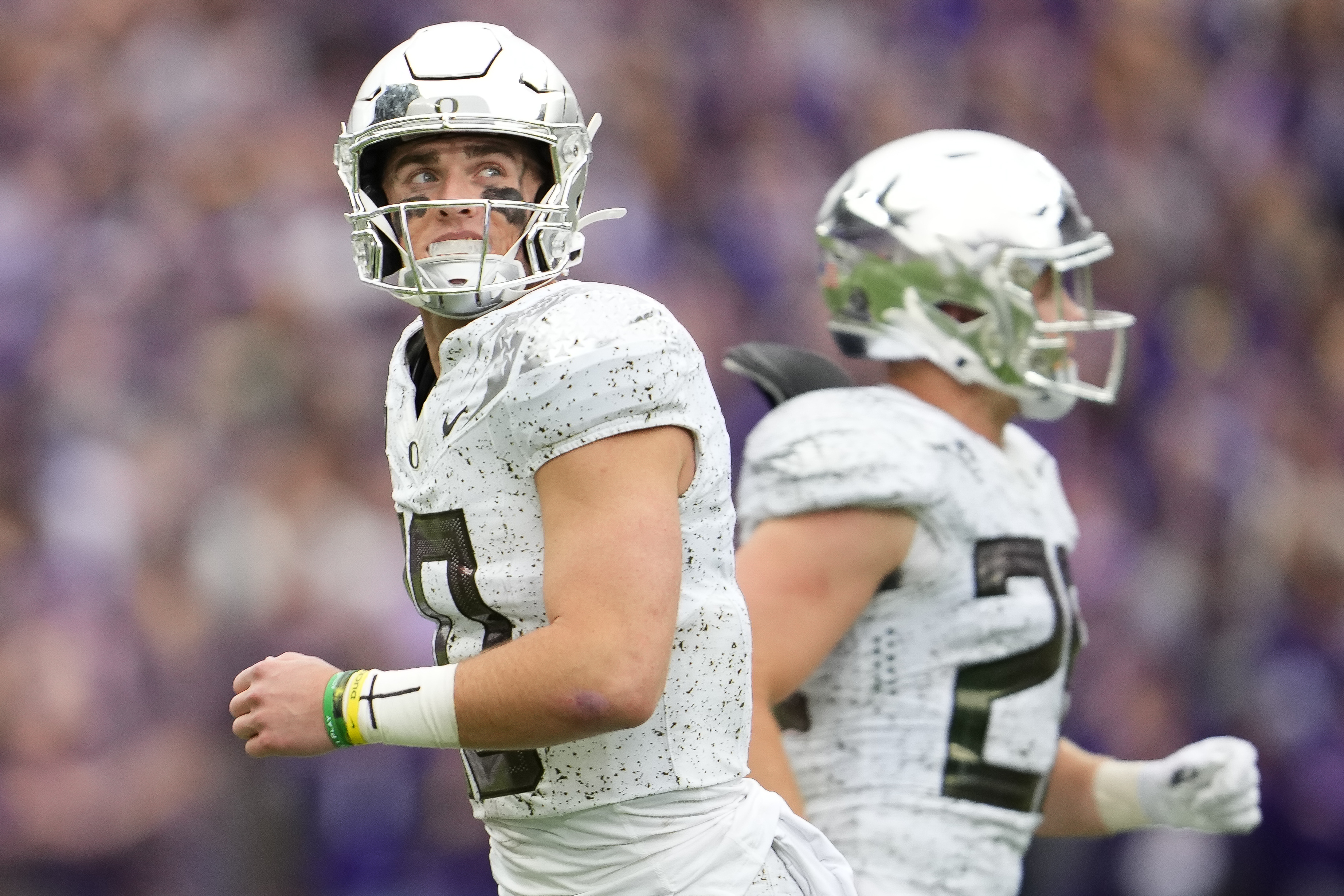 Oregon quarterback Bo Nix jogs off the field after a turnover on downs against Washington during the second half of an NCAA college football game, Saturday, Oct. 14, 2023, in Seattle. Washington won 36-33. (AP Photo/Lindsey Wasson) (Lindsey Wasson)