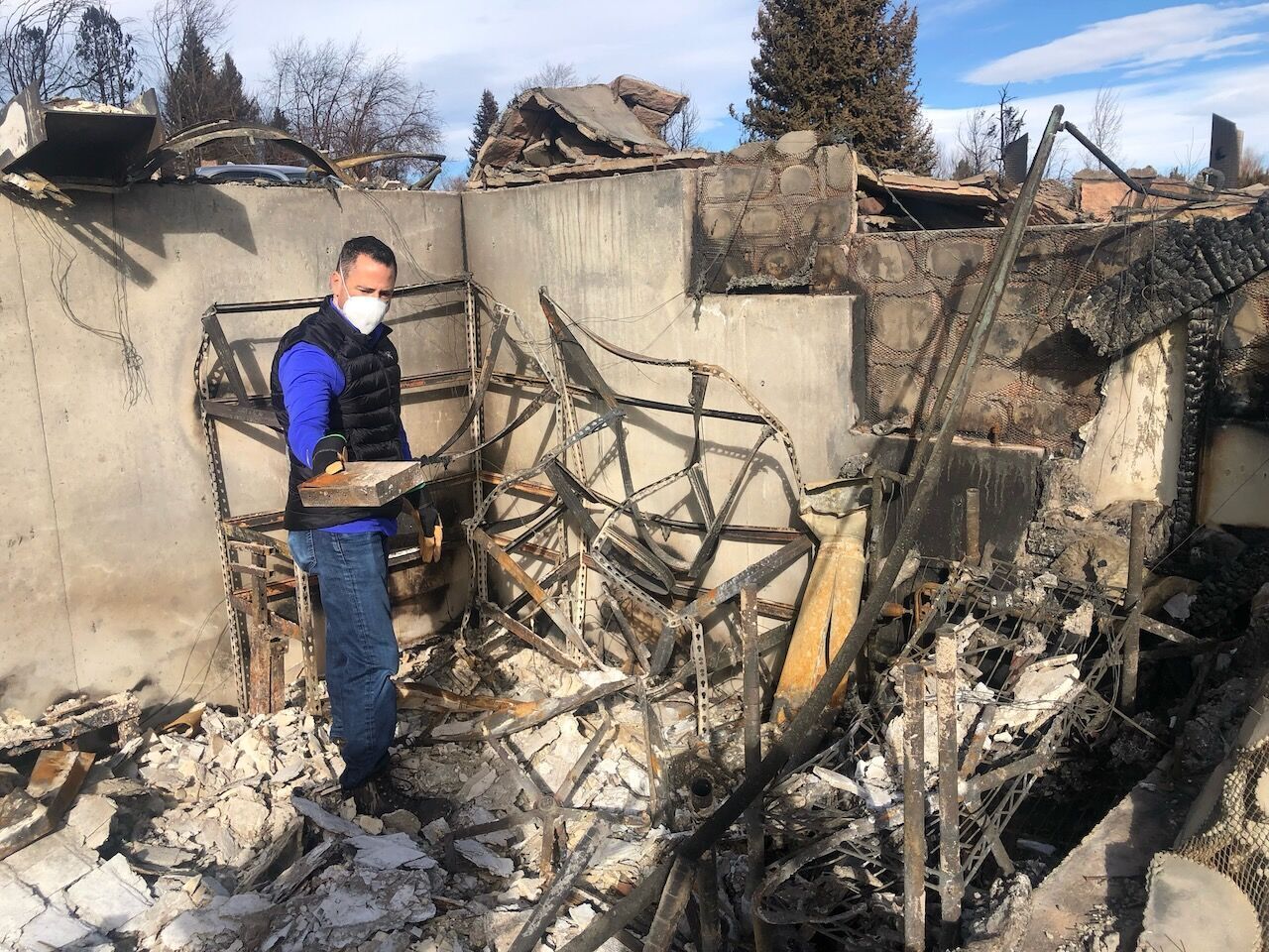 FILE PHOTO: Mark Carson finds a false book containing jewelry in the ruins of their Louisville home. Every piece in the box had melted due to the intense heat of the Marshall fire. (Courtesy of Mark Carson)