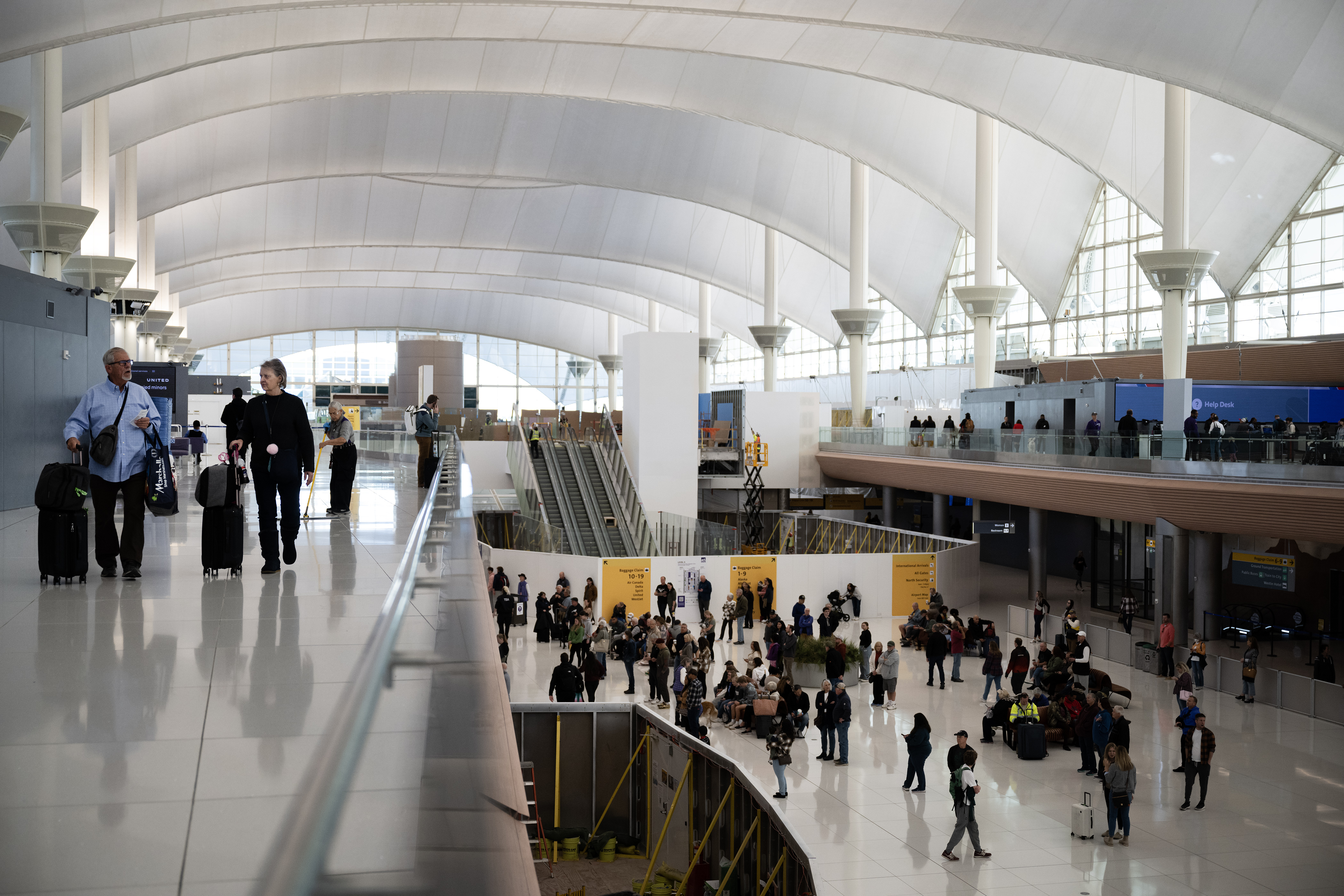 FILE PHOTO: Travelers move around the Domestic Arrivals area on Wednesday, Nov. 22, 2023, at Denver International Airport in Denver. The TSA reported DIA was in the top 10 airports for number of firearms confiscated in 2023. (TimHursttim.hurst@gazette.comhttps://secure.gravatar.com/avatar/aca82bd62b4ee425c598527cd6faa1b1?d=mm&r=g)