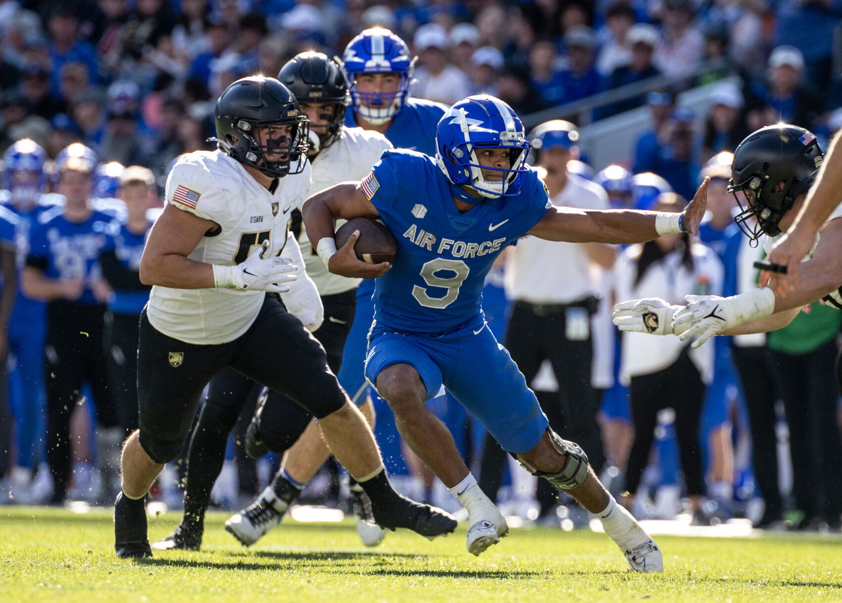 Air Force quarterback Zac Larrier carries the ball in the second half Saturday against Army in Denver. (Parker Seibold, The Gazette)