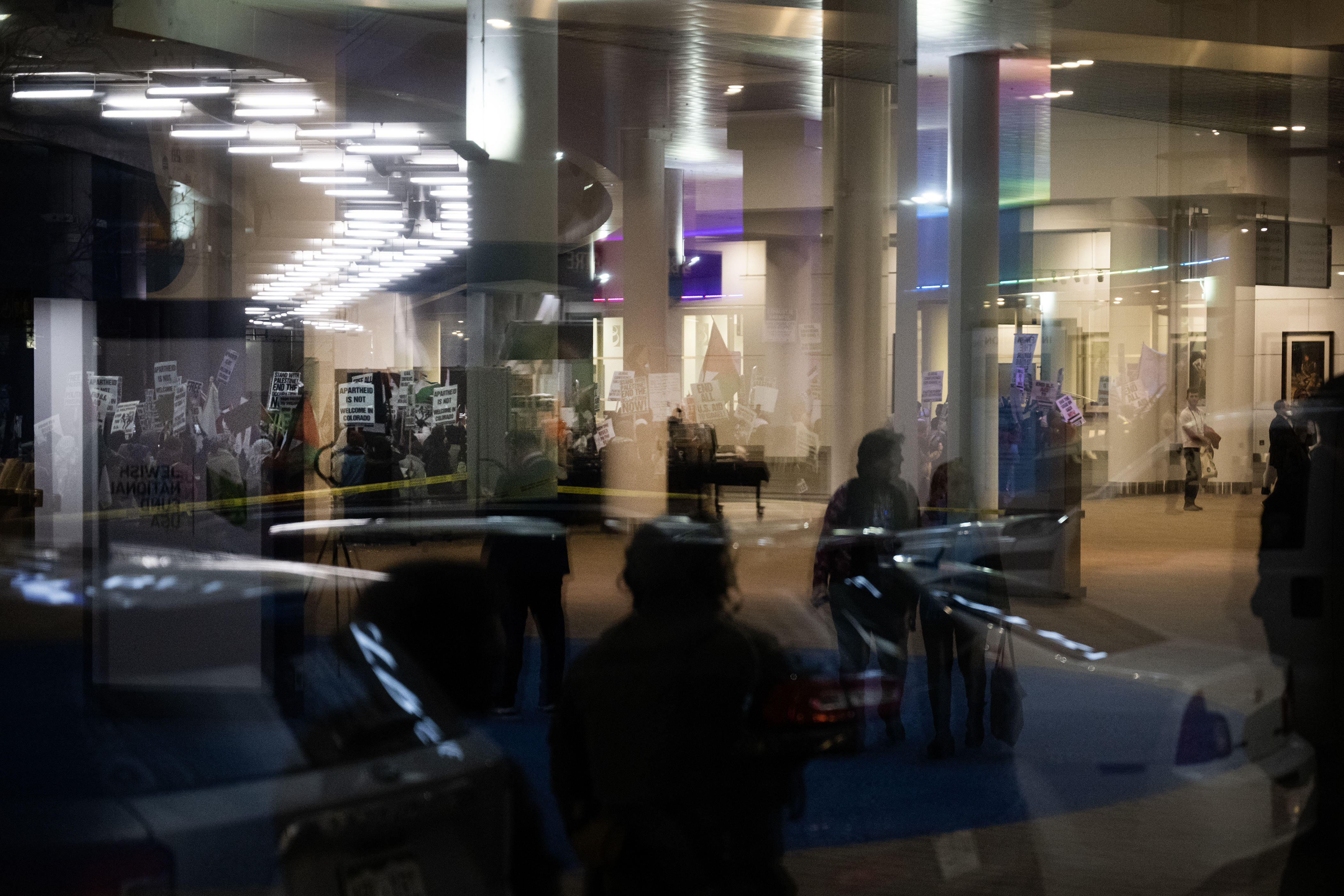 Protestors walk up Stout Street as law enforcement look on from inside the Colorado Convention Center during a protest to disrupt the Jewish National Fund-USA’s Global Conference for Israel’s Opening Plenary on Thursday, November 30, 2023, in Denver, Colo. (Timothy Hurst/Denver Gazette) (TimHursttim.hurst@gazette.comhttps://secure.gravatar.com/avatar/aca82bd62b4ee425c598527cd6faa1b1?d=mm&r=g)