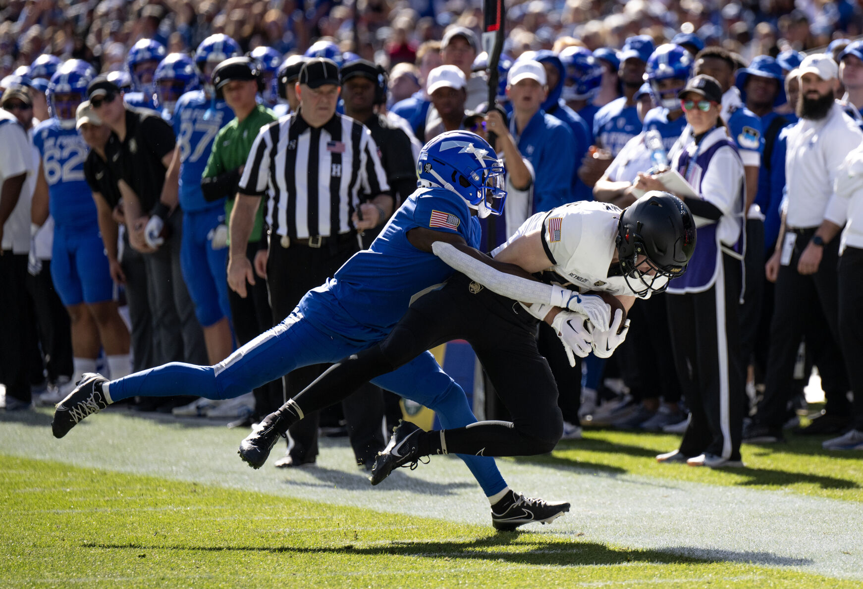 Air Force Falcons defensive back Trey Williams (0) tackles Army Black Knights wide receiver Casey Reynolds (87) in the first half of an NCAA college football game on Saturday, Nov. 4, 2023, at Empower Field at Mile High in Denver, Colo. (Parker Seibold, The Gazette) (Parker Seibold)