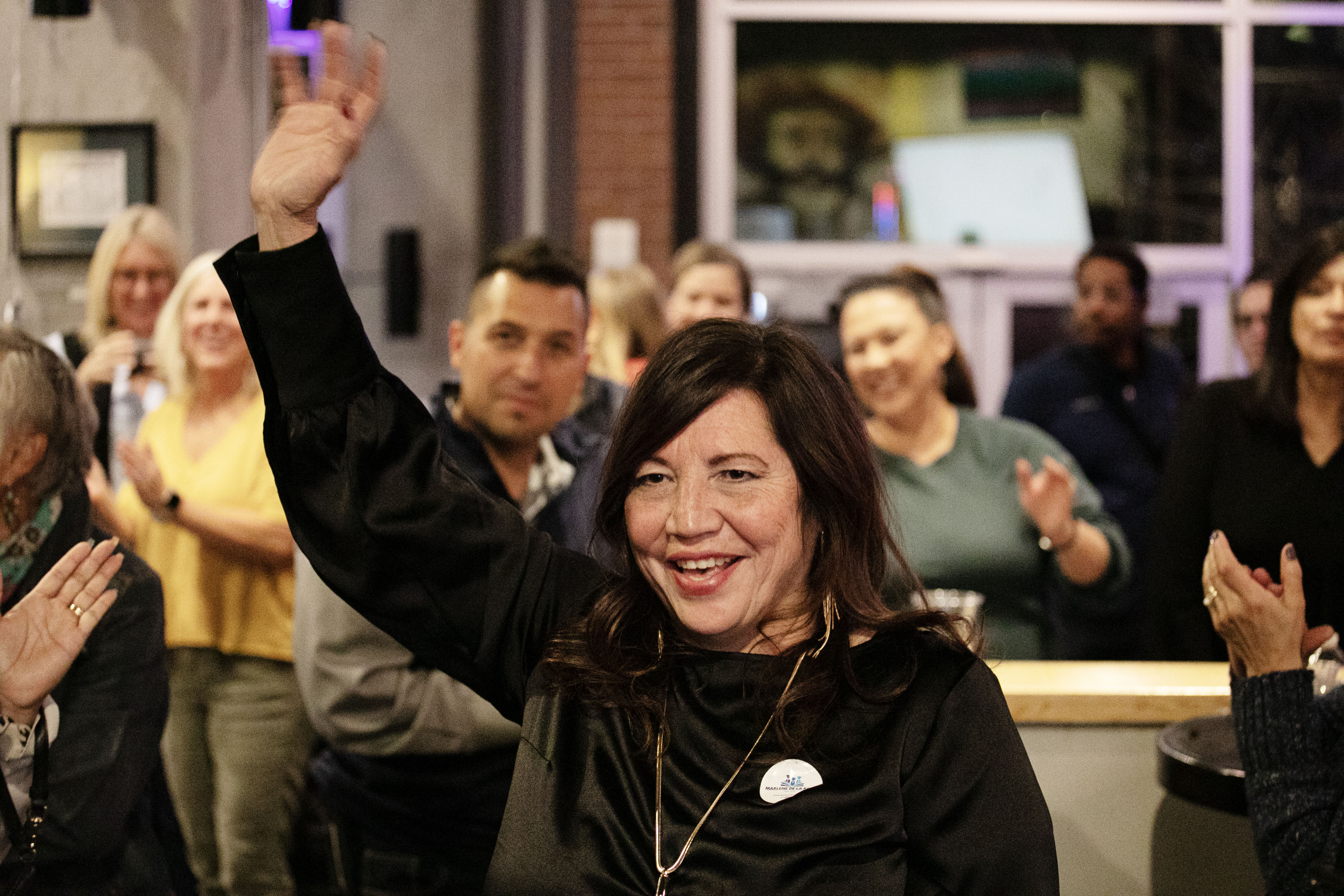 FILE PHOTO: Marlene De La Rosa waves to supporters after a second round of ballots opened a convincing lead in her school board race at a watch party in Denver on Nov. 7, 2023. She will be sworn in Tuesday. (TomHellauerMultimedia Producertom.hellauer@denvergazette.comhttps://denvergazette.com/content/tncms/avatars/f/9e/622/f9e6228a-3b6b-11ed-bf10-fbb71fa8e421.f54b911252c540f1d61709edc4727a39.png)
