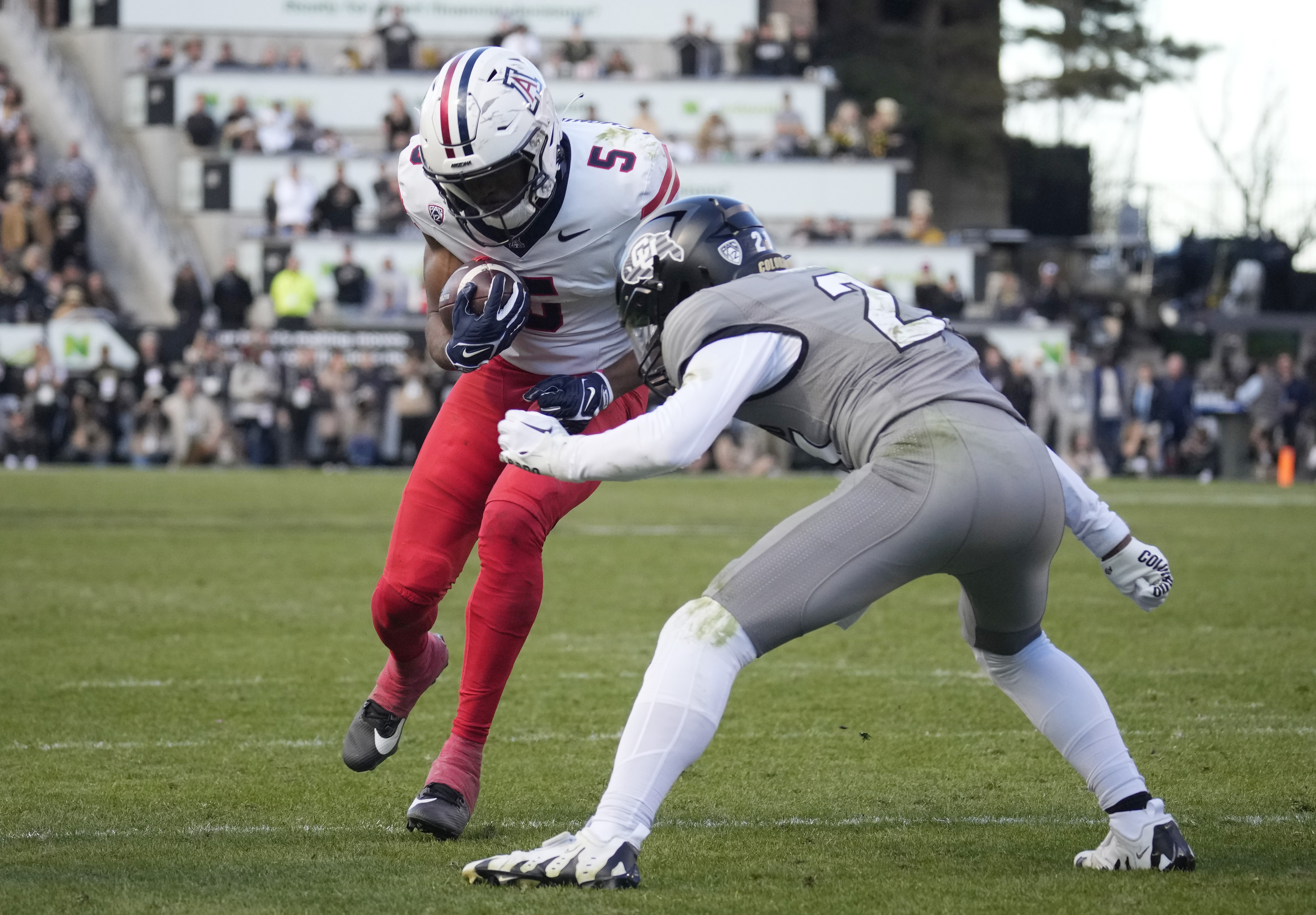 Arizona wide receiver Montana Lemonious-Craig (5) is stopped short of the goalline by Colorado safety Shilo Sanders (2) in the second half of an NCAA college football game on Saturday, Nov. 11, 2023, in Boulder, Colo. (AP Photo/David Zalubowski) (David Zalubowski)