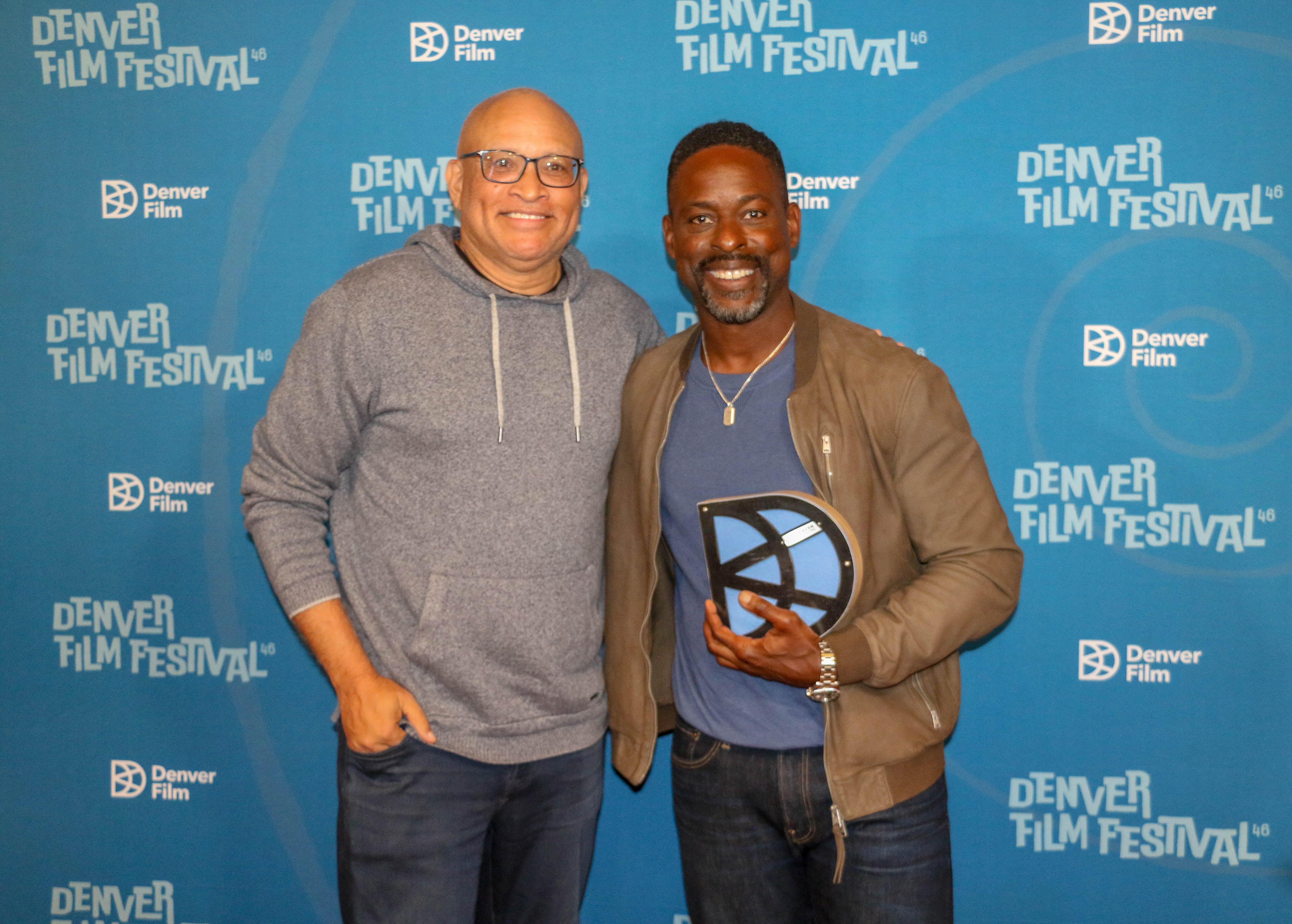Actor Sterling K. Brown, right, accepts the Denver Film Festival's Excellence in Acting Award at a screening of his new film 