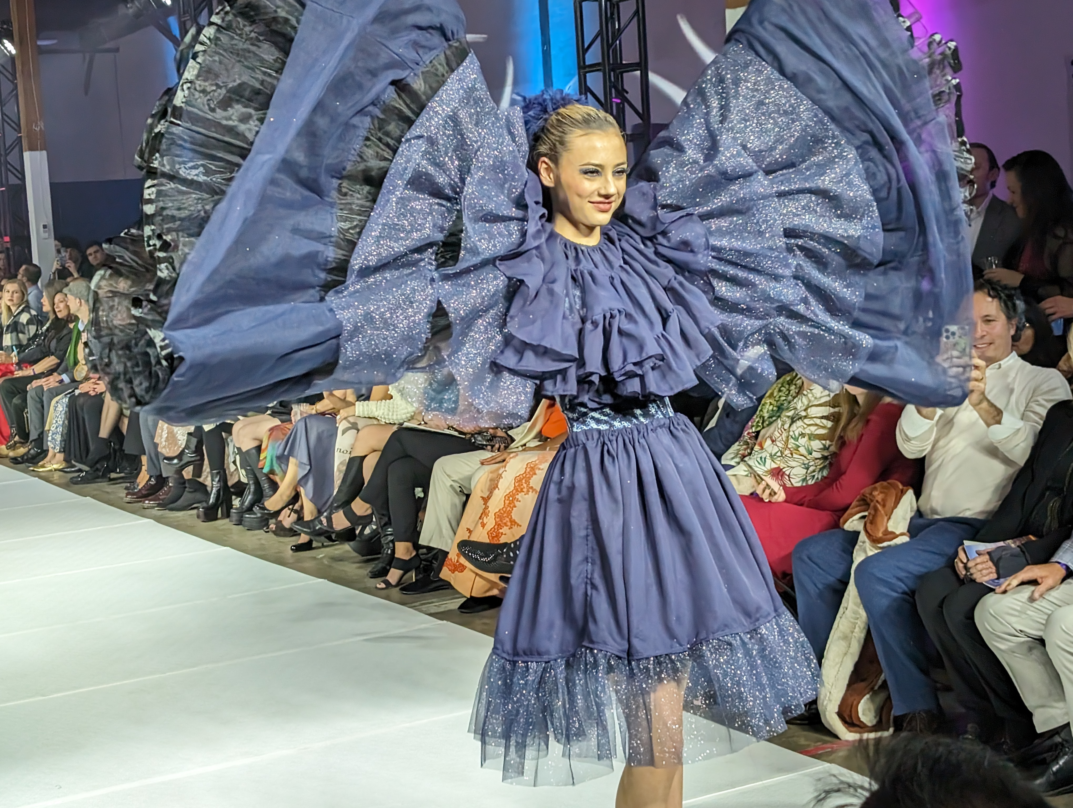 One of Alexander's dresses, layered with various deep blue fabrics, shows off his uncanny ability to drape dresses.