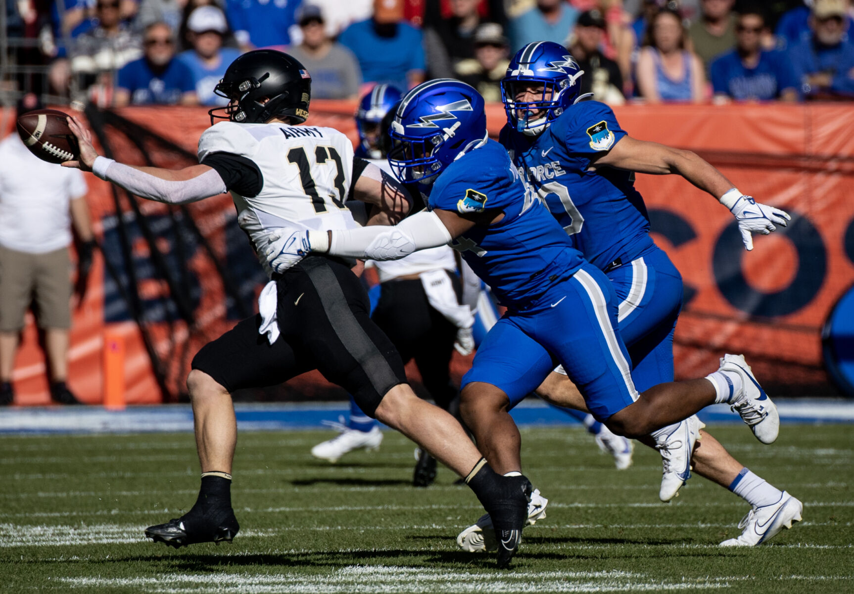 Air Force Falcons linebacker Johnathan Youngblood (44) tackles Army Black Knights quarterback Bryson Daily (13) in the first half of an NCAA college football game on Saturday, Nov. 4, 2023, at Empower Field at Mile High in Denver, Colo. (Parker Seibold, The Gazette) (Parker Seibold)