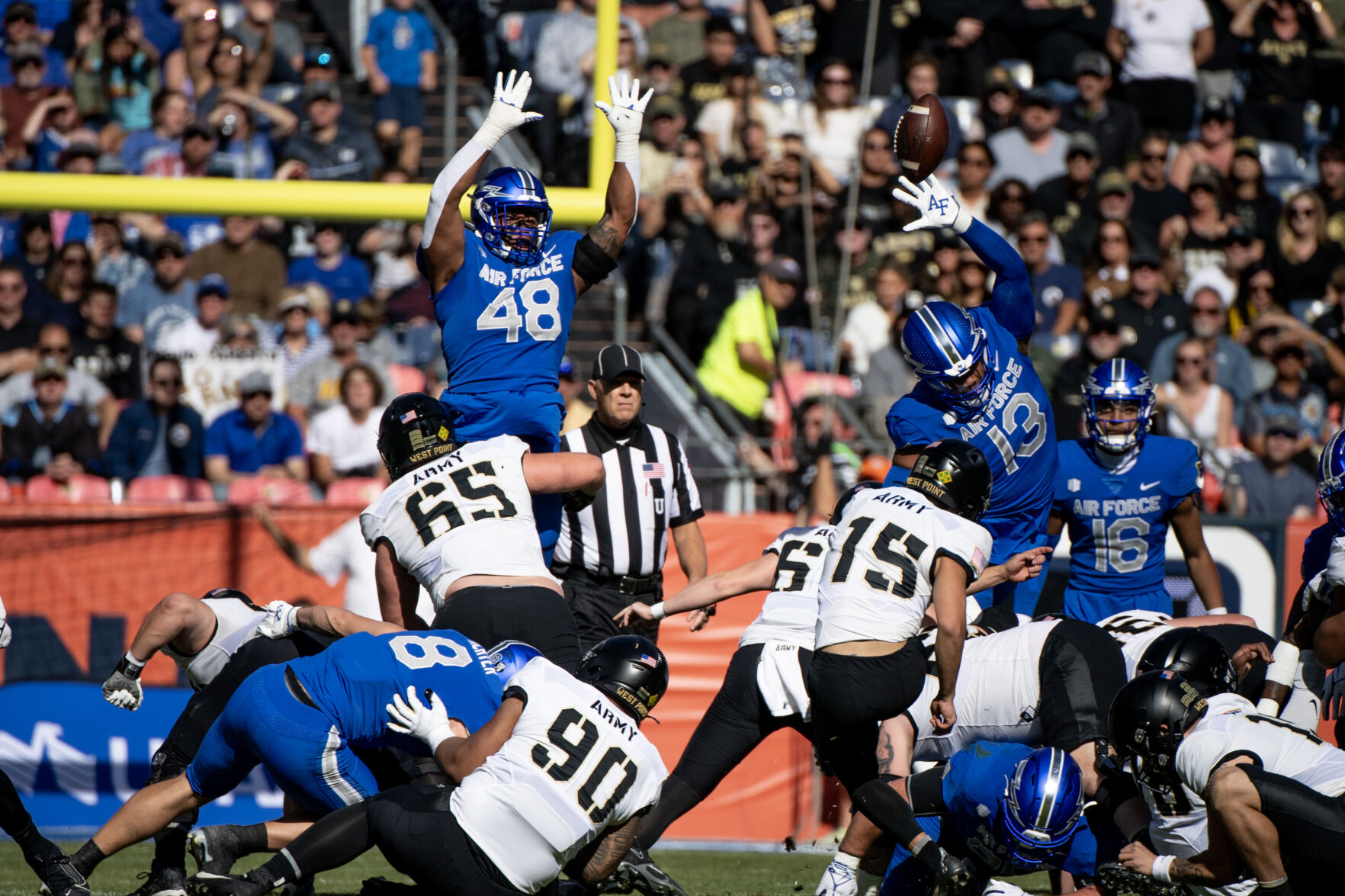 Air Force Falcons defensive end Jayden Thiergood (48) and Air Force Falcons linebacker PJ Ramsey (13) jump in attempt to block a field goal in the first half of an NCAA college football game against the Army Black Knights on Saturday, Nov. 4, 2023, at Empower Field at Mile High in Denver, Colo. (Parker Seibold, The Gazette) (Parker Seibold)