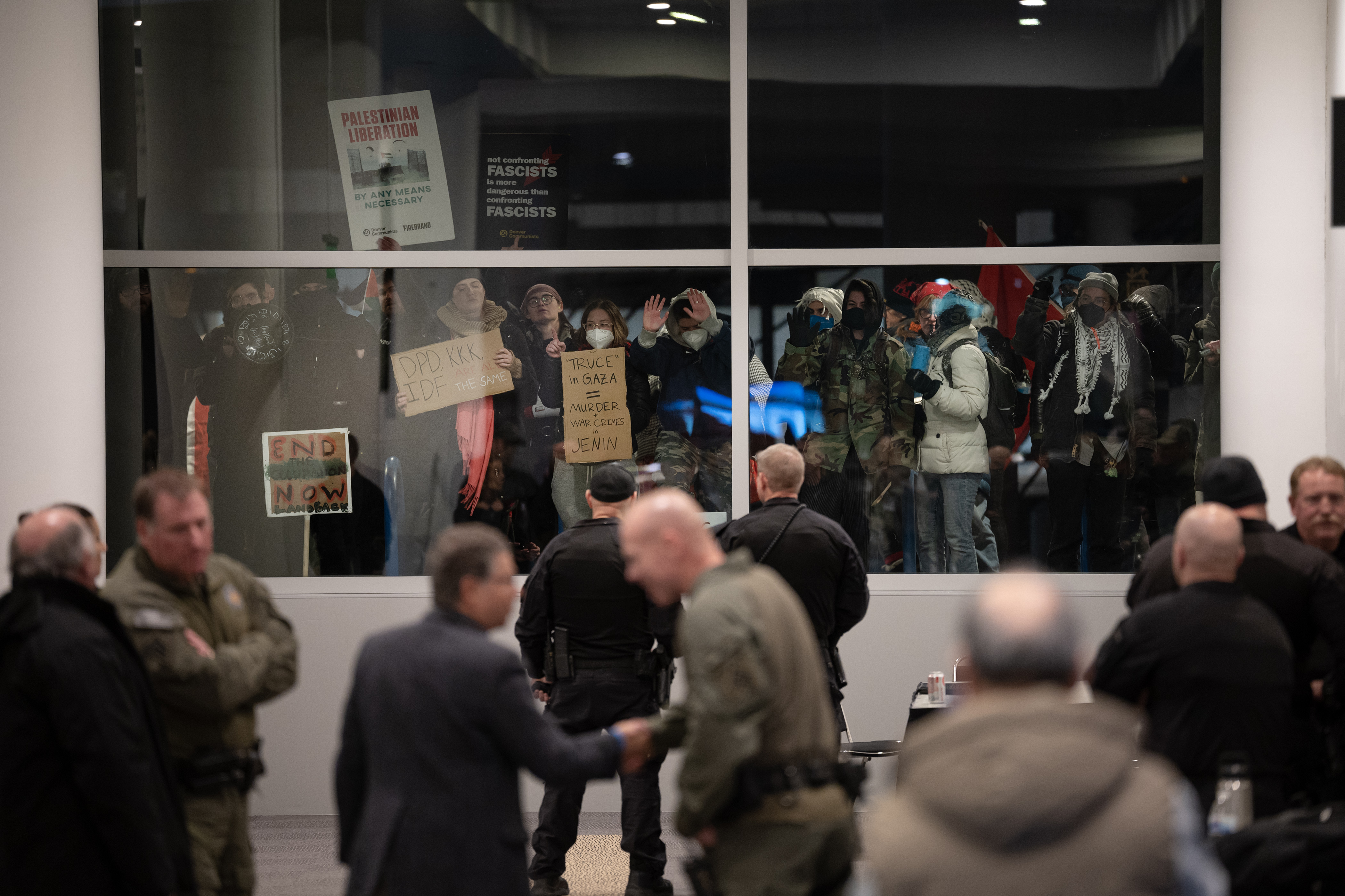 Protestors bang on windows during a protest to disrupt the Jewish National Fund-USA’s Global Conference for Israel’s Opening Plenary on Thursday, November 30, 2023, at the Colorado Convention Center in Denver, Colo. (Timothy Hurst/Denver Gazette) (TimHursttim.hurst@gazette.comhttps://secure.gravatar.com/avatar/aca82bd62b4ee425c598527cd6faa1b1?d=mm&r=g)