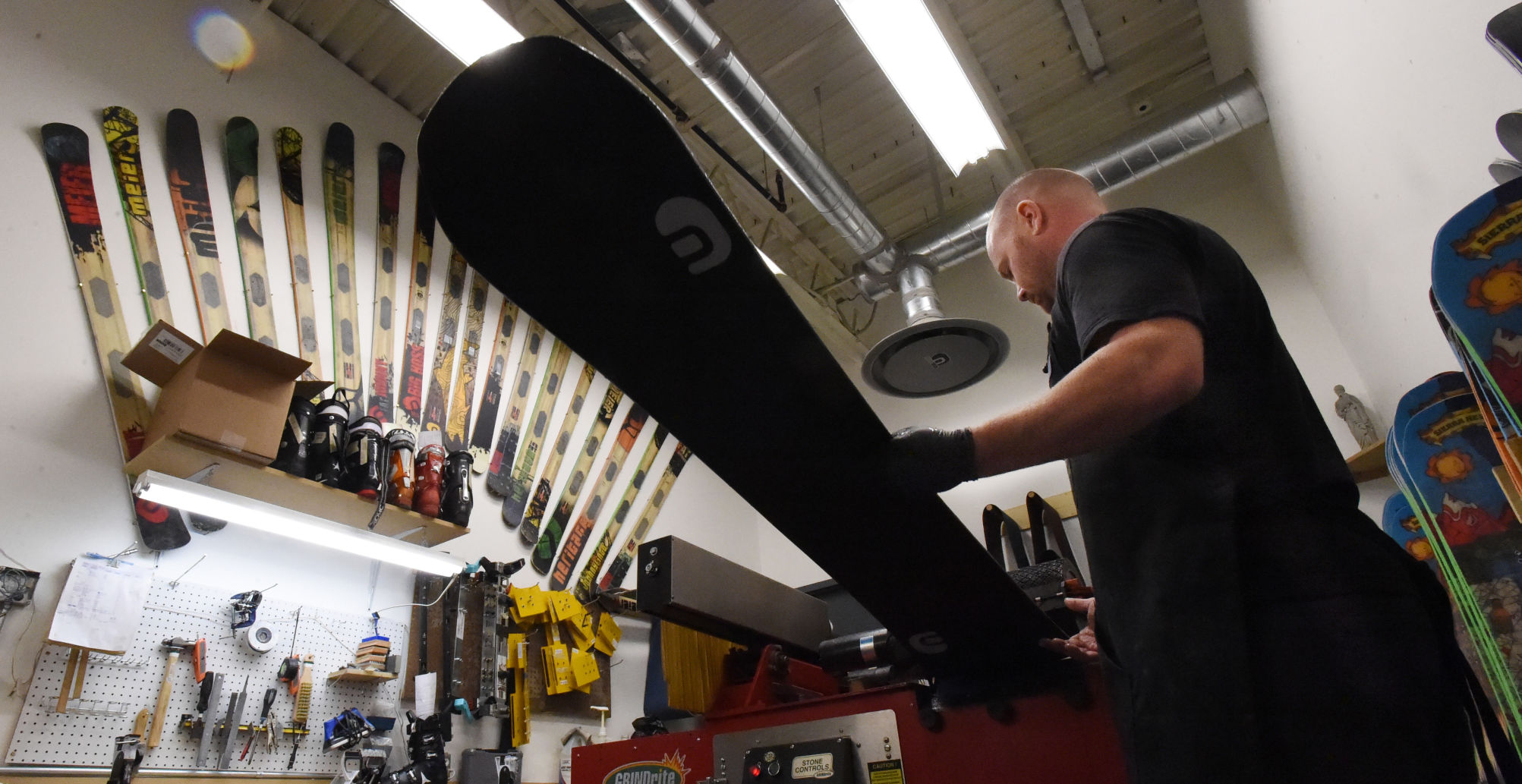 Tony Evans works on the production of one of the handmade snowboards at Meier Skis. The skis are made in Denver. Tuesday, November 28, 2017. (Photo by Jerilee Bennett, The Gazette) (Meier. Jerilee Bennett)
