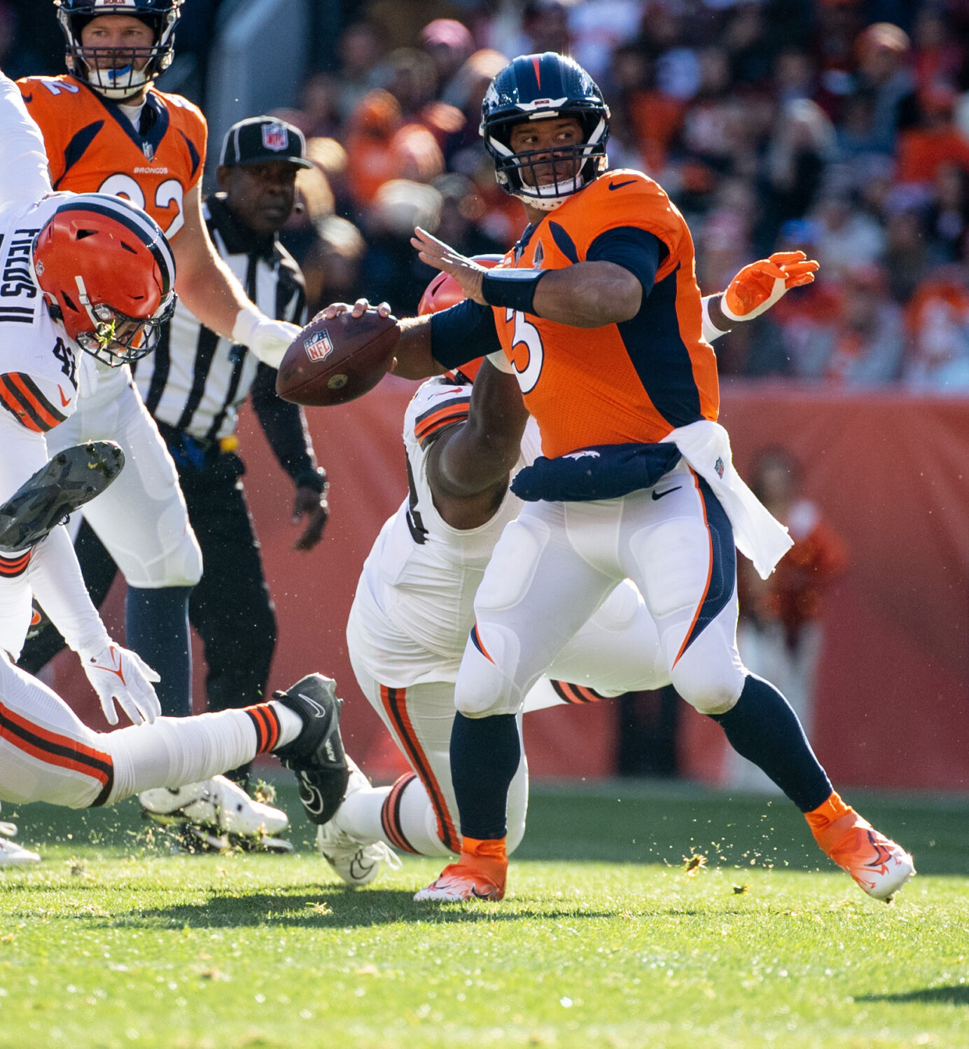 Denver Broncos quarterback Russell Wilson (3) throws the ball before being tackled in the first half of a game on Sunday, Nov. 26, 2023, at Empower Field at Mile High in Denver, Colo. (Parker Seibold, The Gazette)