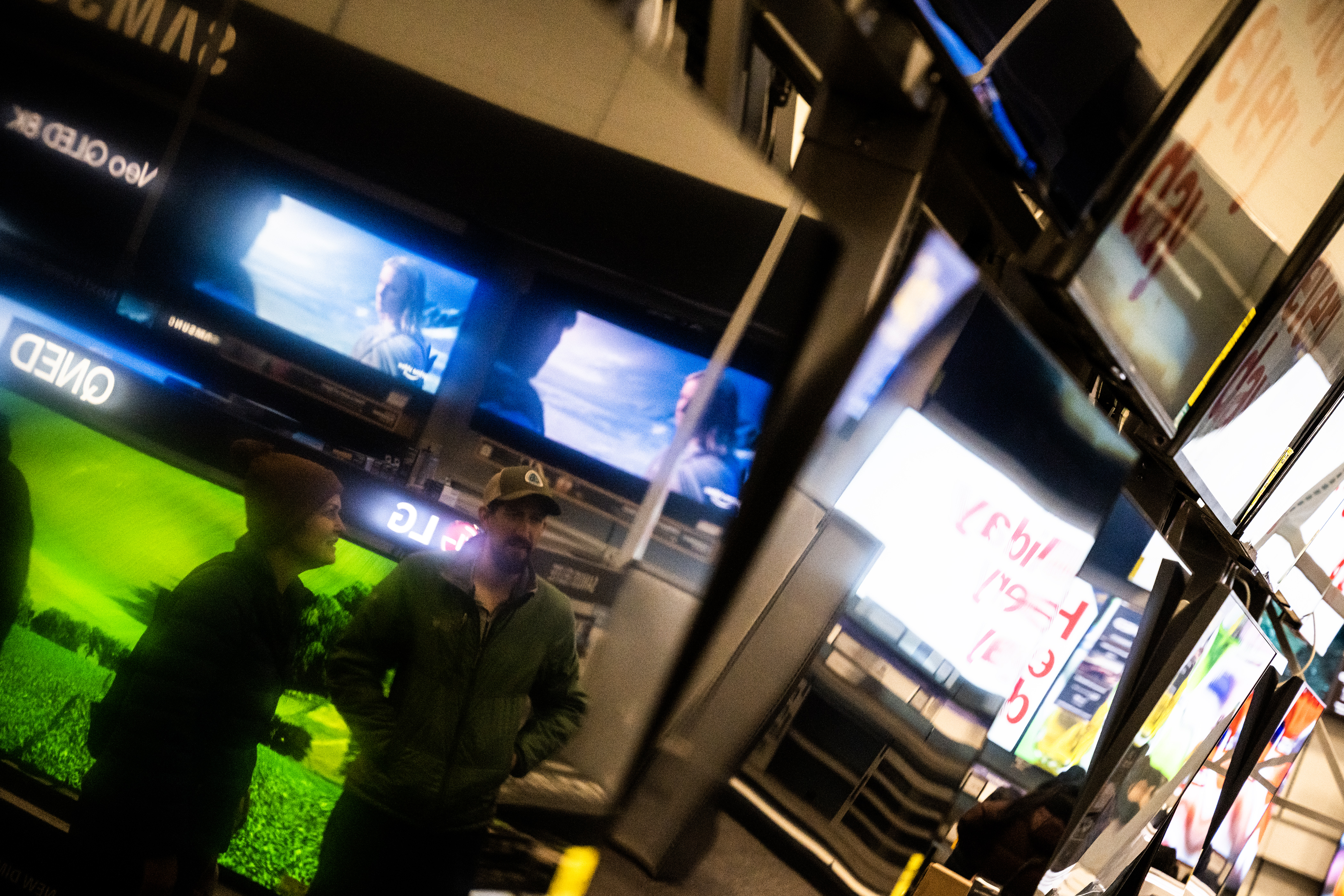 Customers who preferred to remain anonymous are seen in the reflection of a wall of televisions for sale at Best Buy on Thursday, Nov. 24, 2023, in Lone Tree, Colo. (Timothy Hurst/Denver Gazette) (TimHursttim.hurst@gazette.comhttps://secure.gravatar.com/avatar/aca82bd62b4ee425c598527cd6faa1b1?d=mm&r=g)