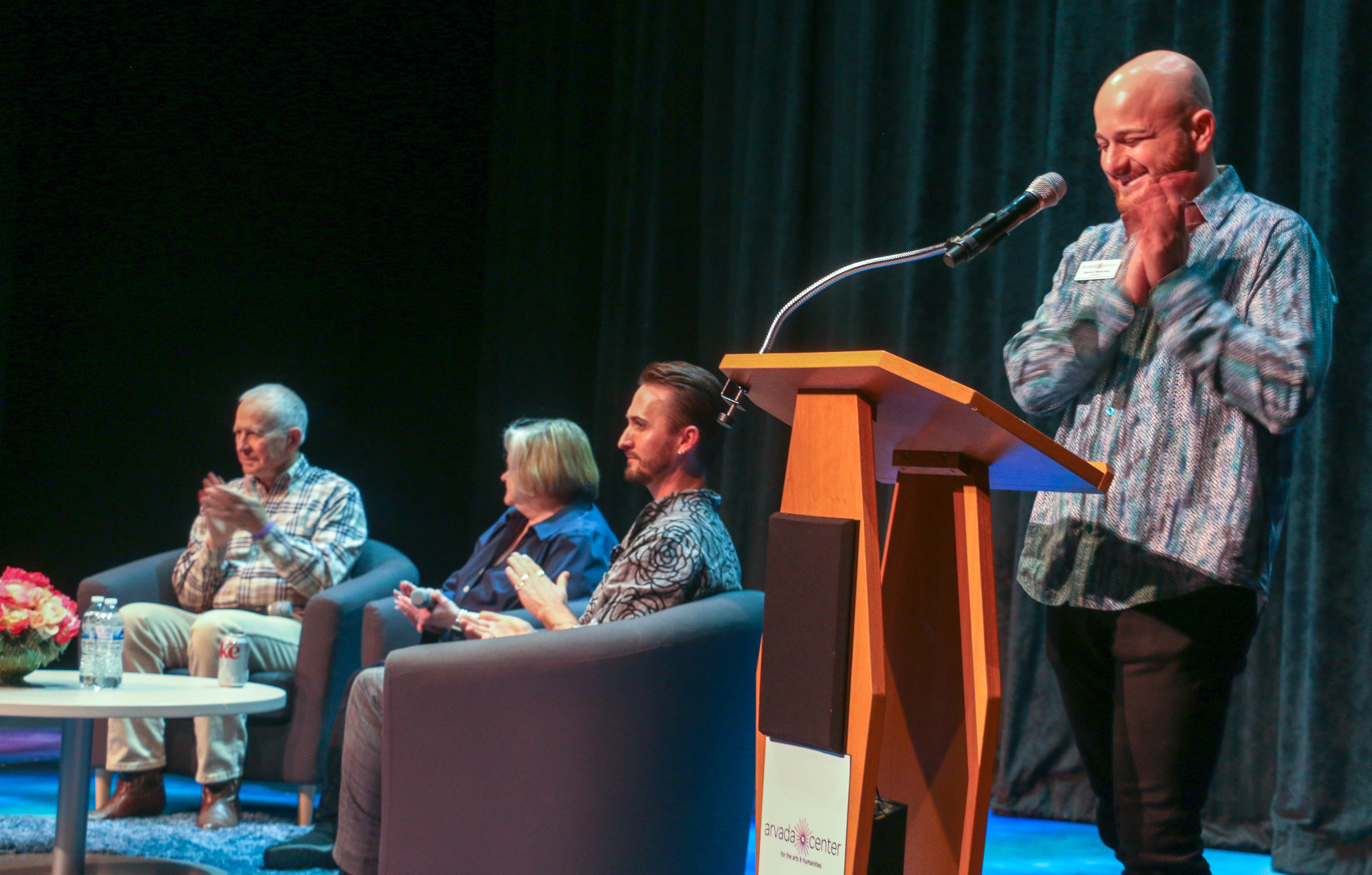 The Arvada Center's Director of Giving Jarrod Markman introduces Dennis and Judy Shepard, with moderator Brett Lord, for a conversation with the audiences after the Oct. 29 performance of