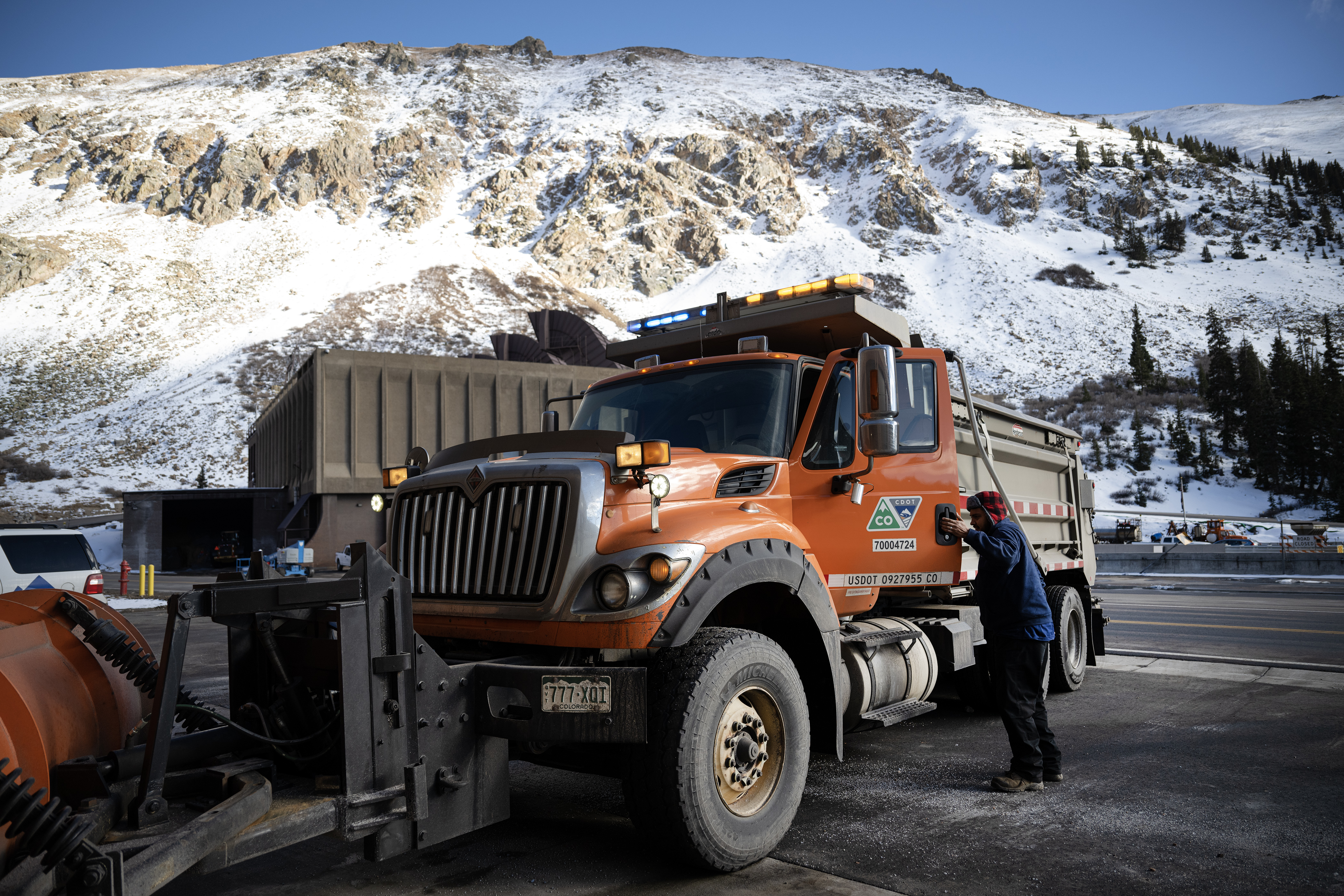 Colorado Department of Transportation professional highway maintenance crew member Aron Piedra prepares to back a plow into a bay of the maintenance facility on Friday, Nov. 17, 2023, at the West Portal of the Eisenhower–Edwin C. Johnson Memorial Tunnel in Summit County, Colo. (Timothy Hurst/Denver Gazette) (TimHursttim.hurst@gazette.comhttps://secure.gravatar.com/avatar/aca82bd62b4ee425c598527cd6faa1b1?d=mm&r=g)