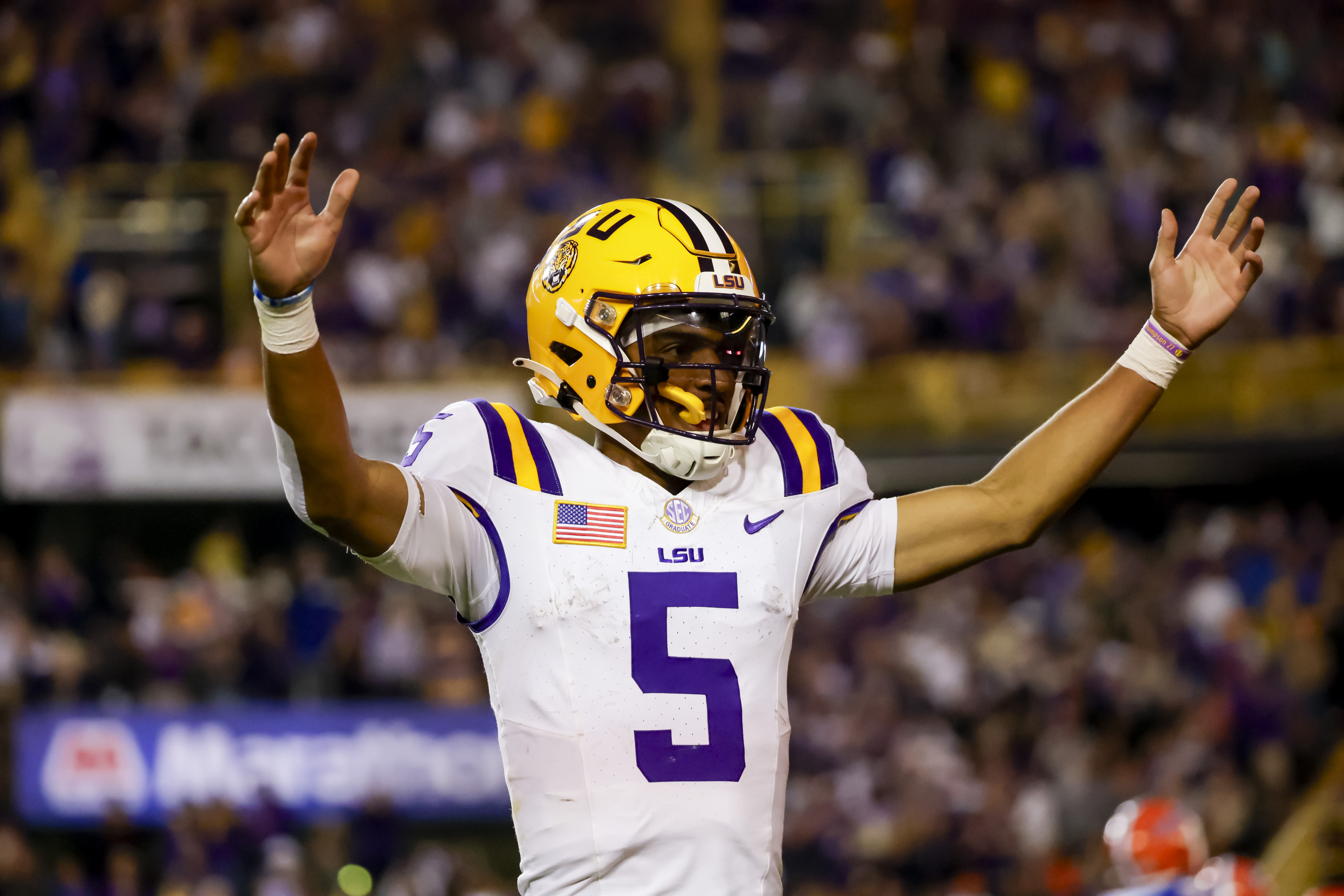LSU quarterback Jayden Daniels (5) celebrates after a touchdown against Florida during the second half of an NCAA college football game in Baton Rouge, La., Saturday, Nov. 11, 2023. (AP Photo/Derick Hingle) (Derick Hingle)