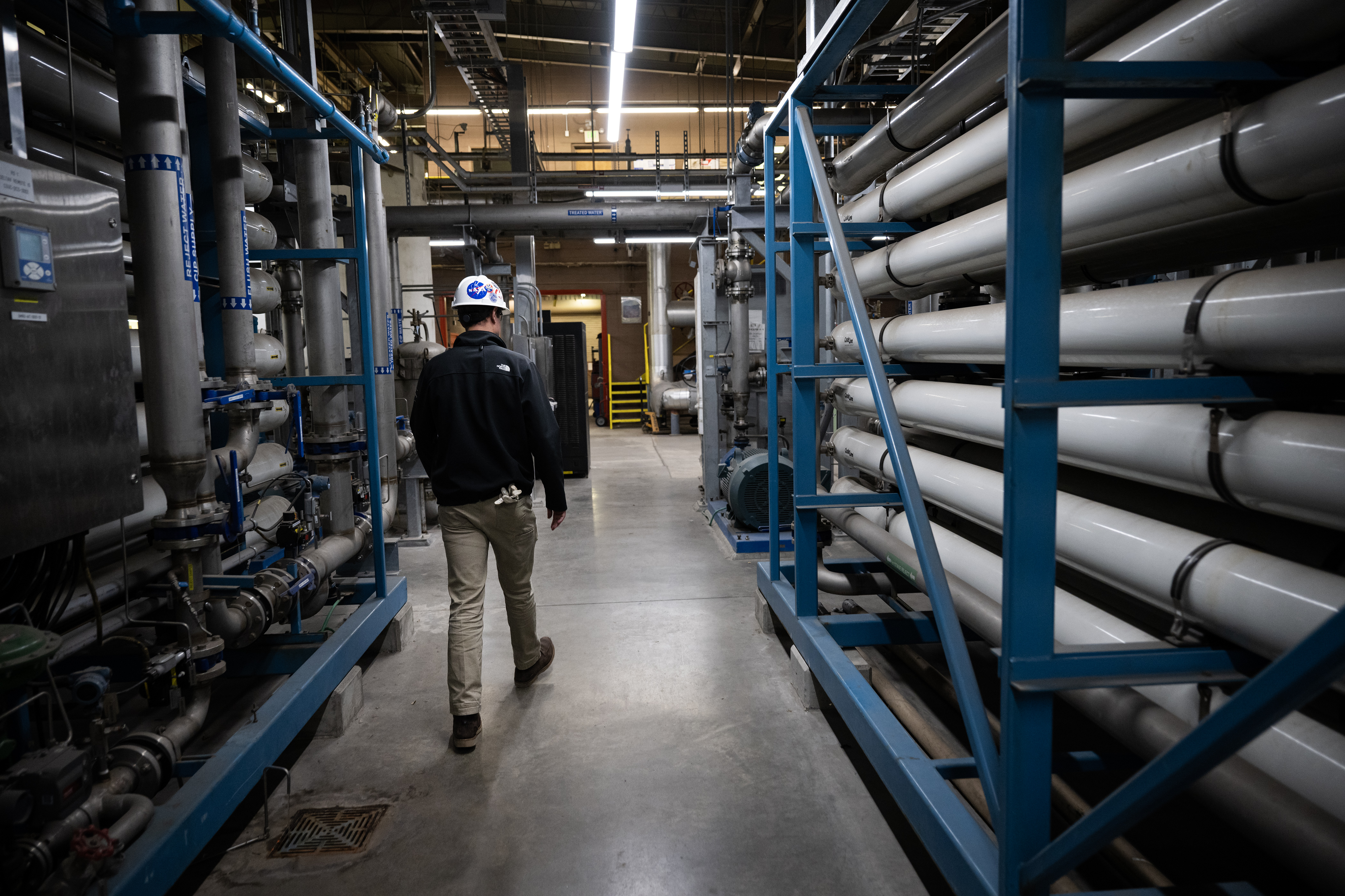Xcel Energy business development analyst Joe Schwark walks past rows of reverse osmosis units while giving a tour of the facility on Wednesday, Nov. 15, 2023, at the Xcel Energy Denver Steam Plant in Denver, Colo. (Timothy Hurst/Denver Gazette) (TimHursttim.hurst@gazette.comhttps://secure.gravatar.com/avatar/aca82bd62b4ee425c598527cd6faa1b1?d=mm&r=g)