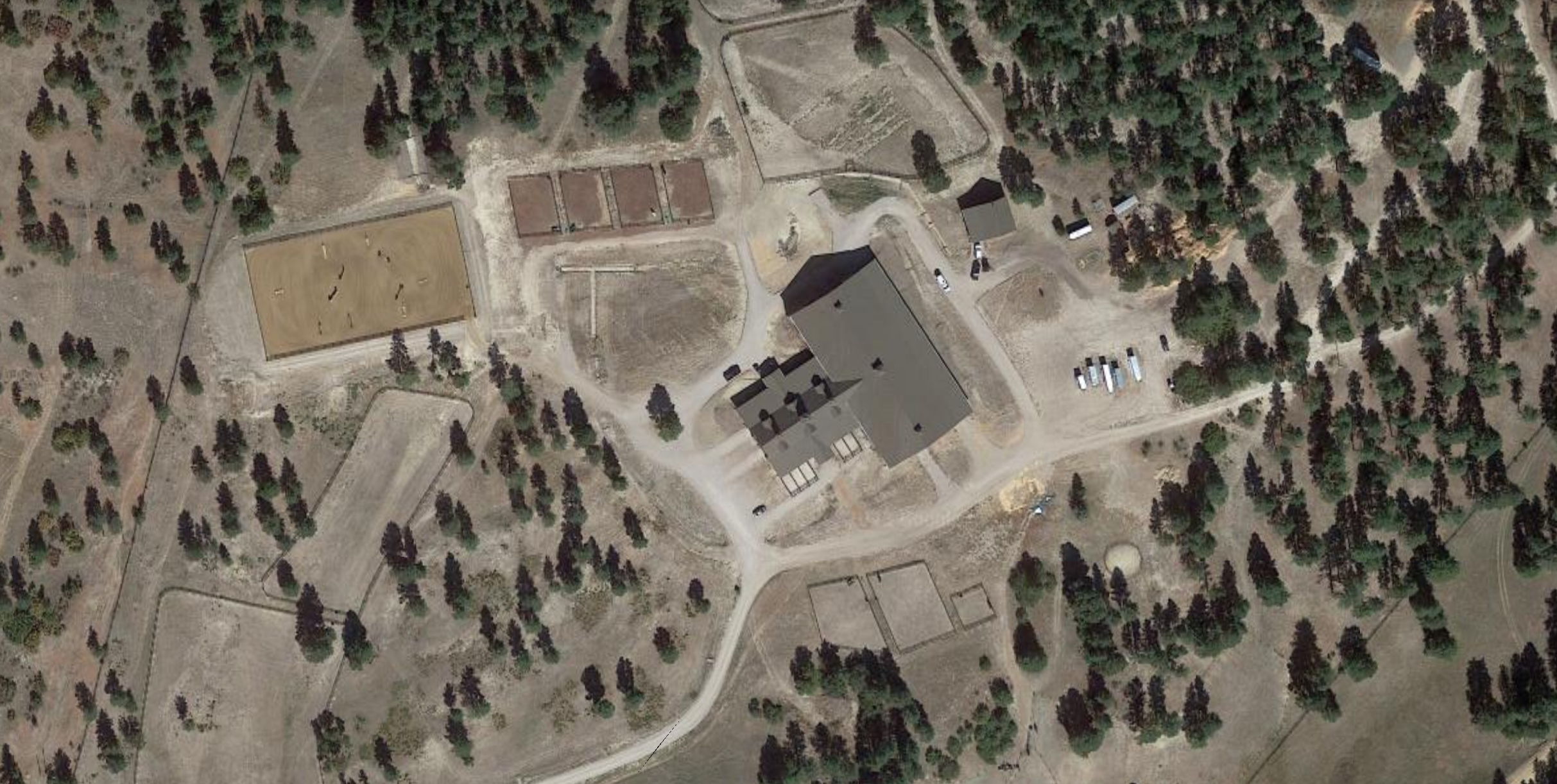 At least nine horses died and a ranch caretaker was hospitalized suffering from smoke inhalation in an early morning Monday fire that destroyed a $2.4 million arena and stable complex at 854 Russellville Road in Douglas County. (GoogleEarth)