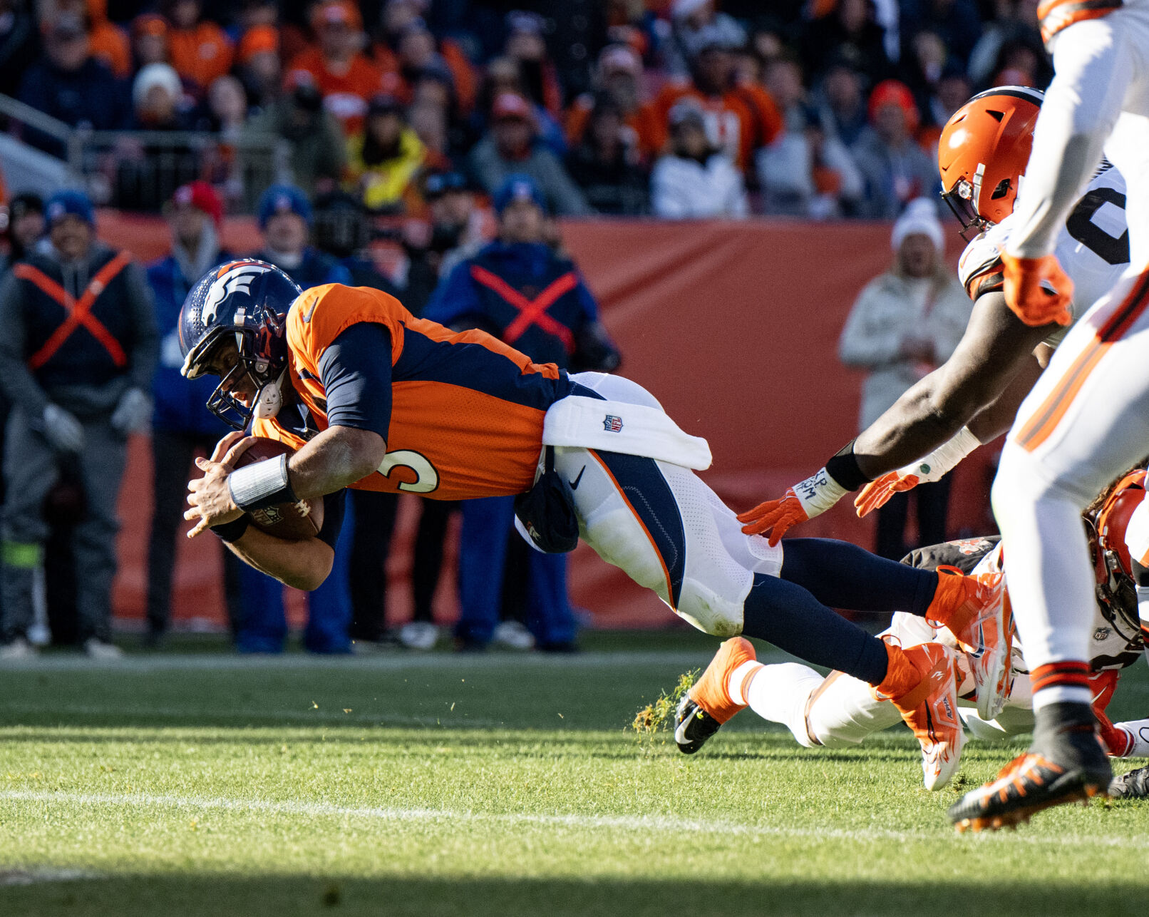 Denver Broncos quarterback Russell Wilson (3) scores a touchdown in the first half of a game on Sunday, Nov. 26, 2023, at Empower Field at Mile High in Denver, Colo. (Parker Seibold, The Gazette) (Parker Seibold)