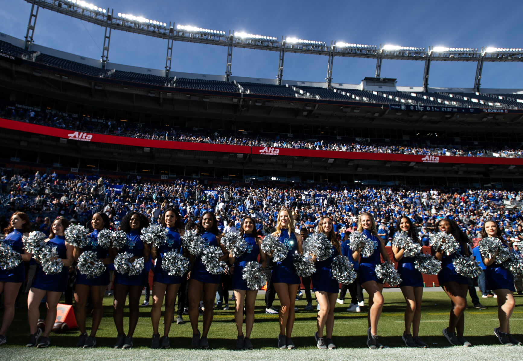 Air Force Academy cheerleaders line the field before an NCAA college football game against the Army Black Knights on Saturday, Nov. 4, 2023, at Empower Field at Mile High in Denver, Colo. (Parker Seibold, The Gazette) (Parker Seibold)