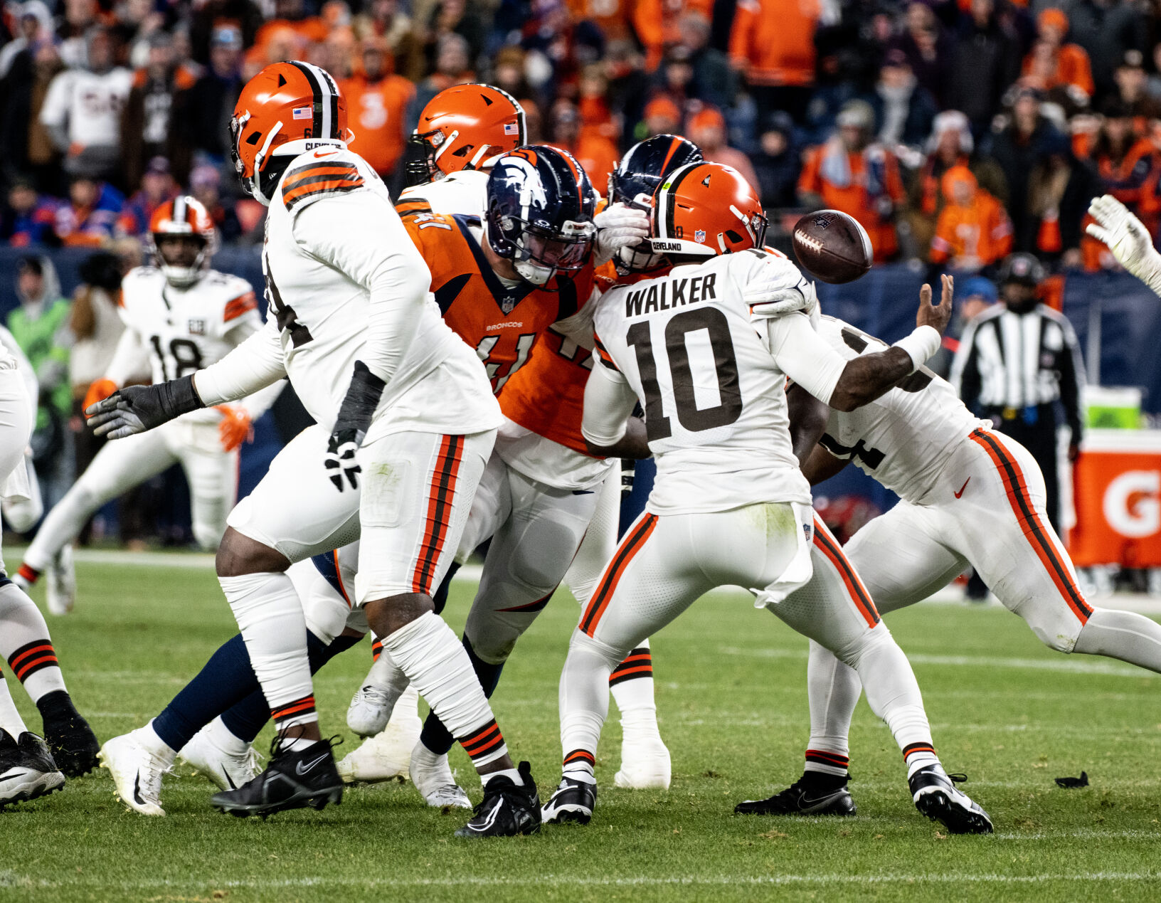 Cleveland Browns quarterback PJ Walker (10) fumbles the ball in the second half of a game on Sunday, Nov. 26, 2023, at Empower Field at Mile High in Denver, Colo. (Parker Seibold, The Gazette) (Parker Seibold)