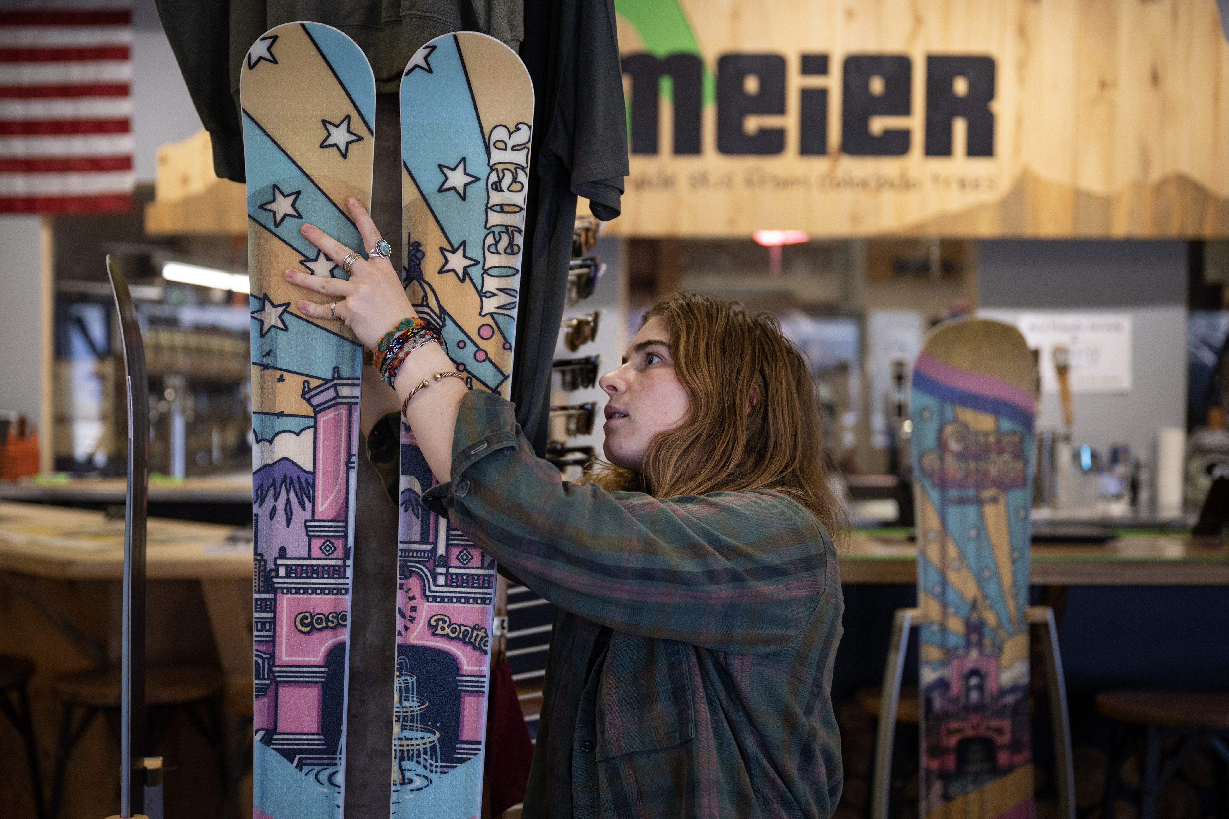 Ski-tender Olivia Humphreys pulls foam separators out from between a pair of Casa Bonita themed Quickdraw skis on display on Tuesday, Nov. 14, 2023, at Meier Skis in Denver, Colo. Meier Skis will sell 500 items wit the limited-run of Casa Bonita graphics, whether that be snowboards, skis or wall art. (Timothy Hurst/Denver Gazette) (TimHursttim.hurst@gazette.comhttps://secure.gravatar.com/avatar/aca82bd62b4ee425c598527cd6faa1b1?d=mm&r=g)