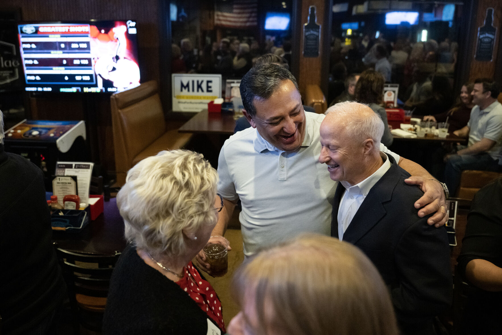 Incumbent Aurora Mayor Mike Coffman is greeted by Aurora Police chief Art Acevedo during the “No On HH - Advance Colorado election night watch party” on Tuesday, Nov. 7, 2023, at JJ's Place in Aurora, Colo. (Timothy Hurst/Denver Gazette) (TimHursttim.hurst@gazette.comhttps://secure.gravatar.com/avatar/aca82bd62b4ee425c598527cd6faa1b1?d=mm&r=g)