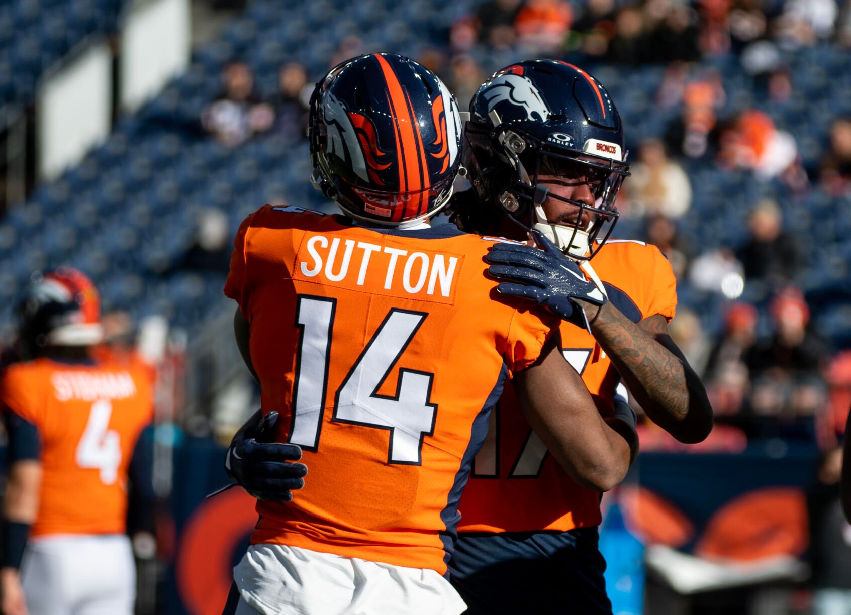 Denver Broncos wide receiver Courtland Sutton (14) and Denver Broncos wide receiver Lil'Jordan Humphrey (17) embrace before a game on Sunday, Nov. 26, 2023, at Empower Field at Mile High in Denver, Colo. (Parker Seibold, The Gazette) (Parker Seibold)
