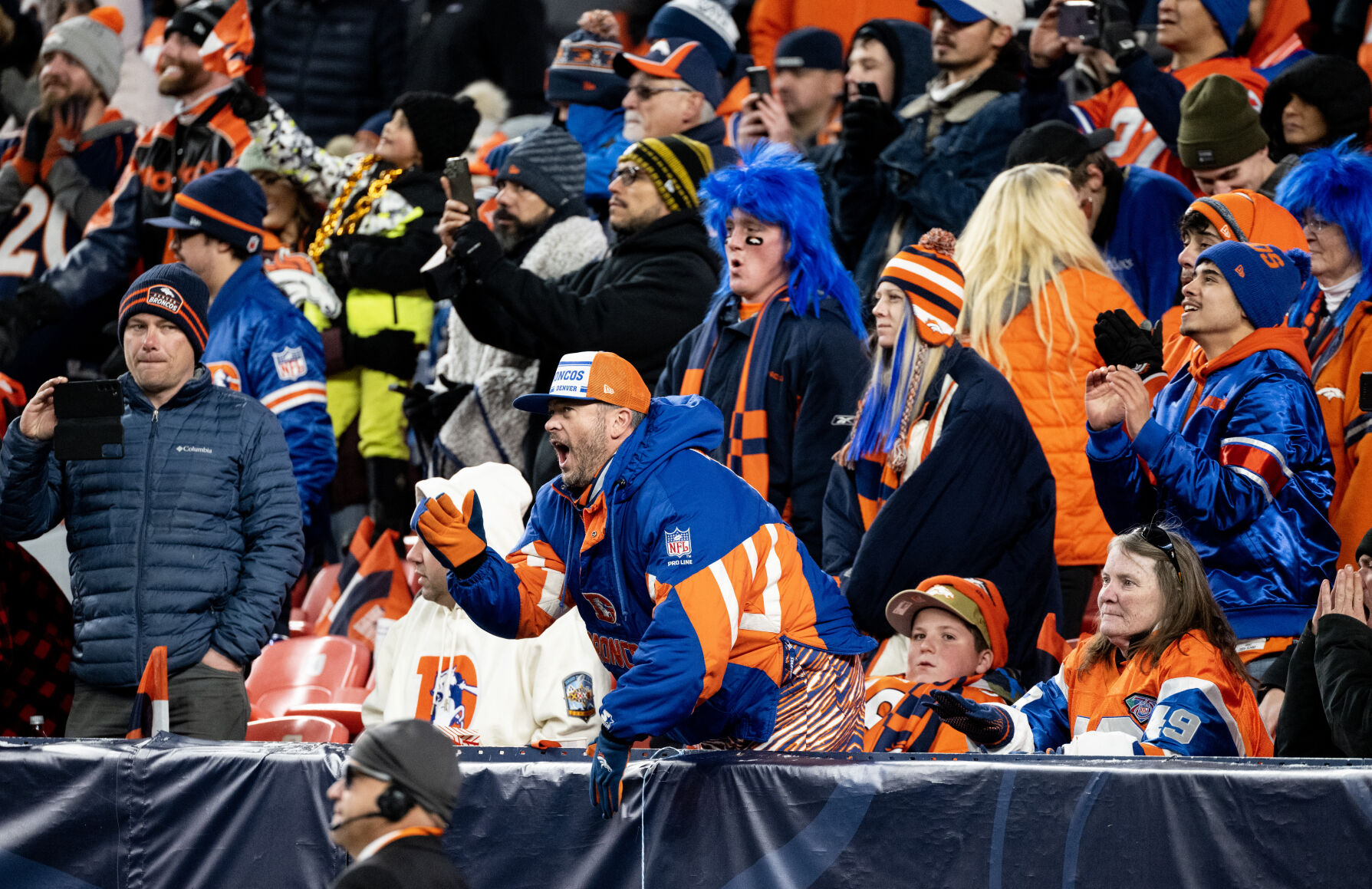 A Broncos fan cheers in the second half of a game on Sunday, Nov. 26, 2023, at Empower Field at Mile High in Denver, Colo. (Parker Seibold, The Gazette) (Parker Seibold)