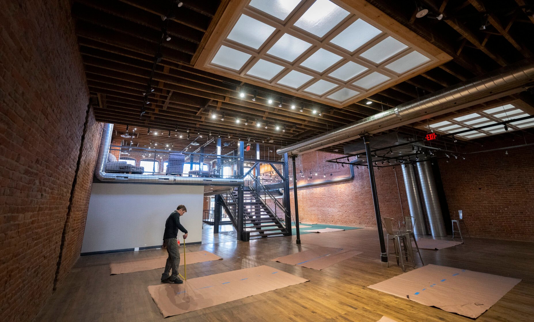 Local restauranteur and businessman Joe Campana measures space for pool tables Wednesday inside a downtown Colorado Springs building at 112 N. Tejon St., which had housed the Tattered Cover bookstore until its closing in October. Campana and partner Lucas Frye have taken over the space and have targeted May 1 for their opening of The Crooked Cue, a new upscale pool hall that also will feature darts, shuffleboard, food, drink and a private gathering area. CHRISTIAN MURDOCK, THE GAZETTE