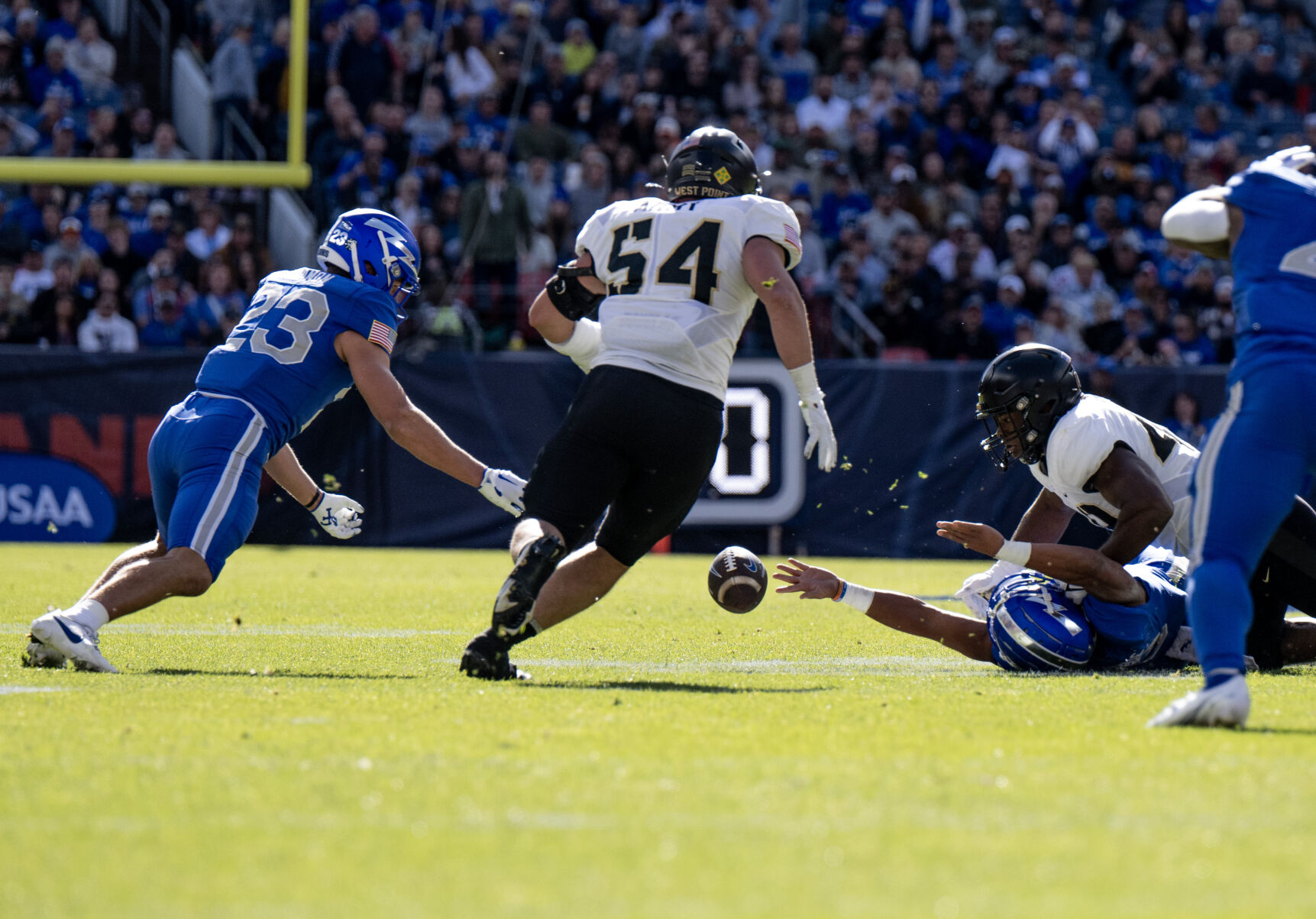 Falcons quarterback Zac Larrier fumbles the ball that is recovered by Falcons wide receiver Dane Kinamon in the first half Nov. 4, 2023, against the Black Knights in Denver. (Parker Seibold, The Gazette)