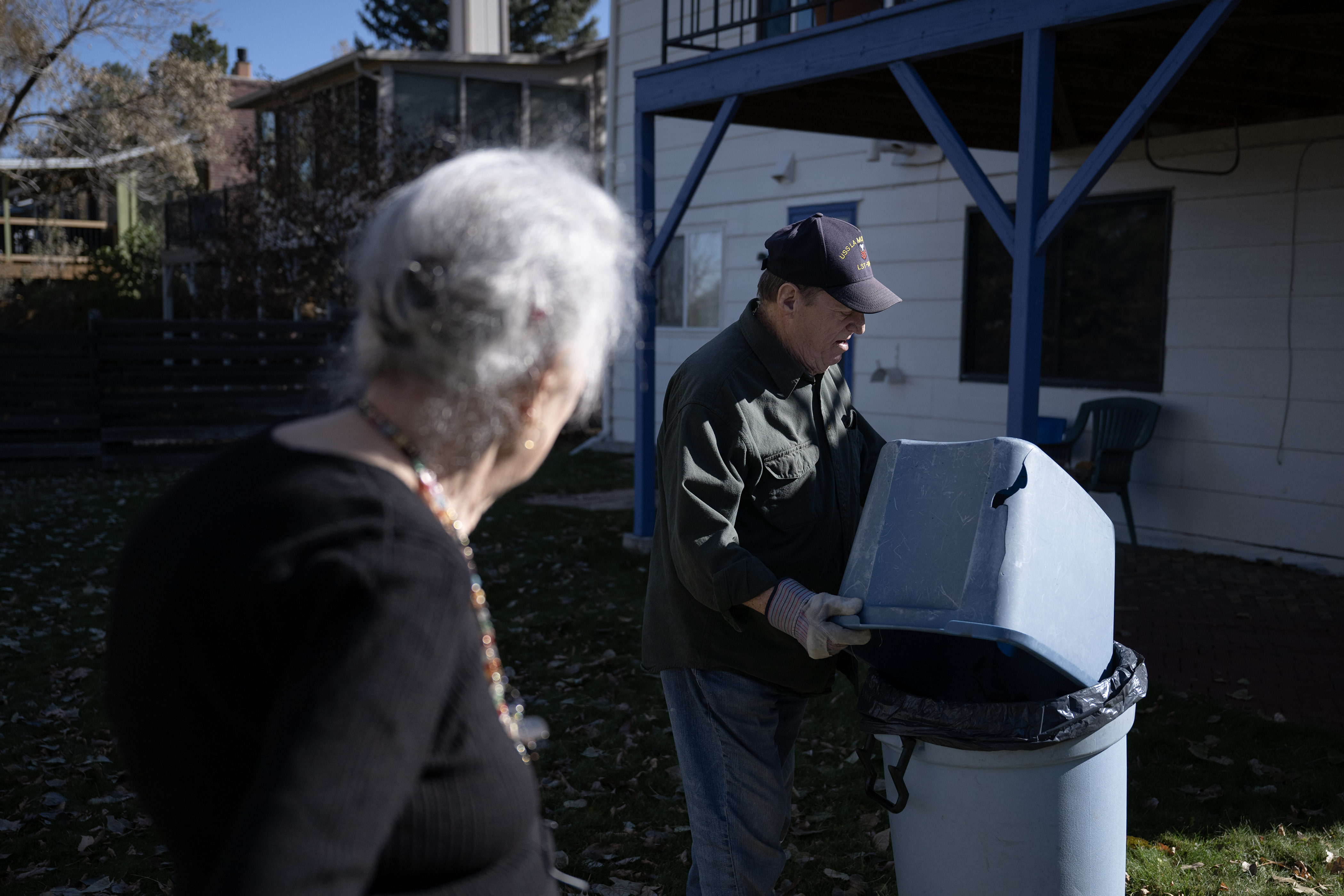 Sally Collins, 87, looks on as Martin J. Holmes III, 75, dumps a tote full of rakes leaves in her backyard on Friday, Nov. 10, 2023, in Arvada, Colo. (Timothy Hurst/Denver Gazette) (TimHursttim.hurst@gazette.comhttps://secure.gravatar.com/avatar/aca82bd62b4ee425c598527cd6faa1b1?d=mm&r=g)