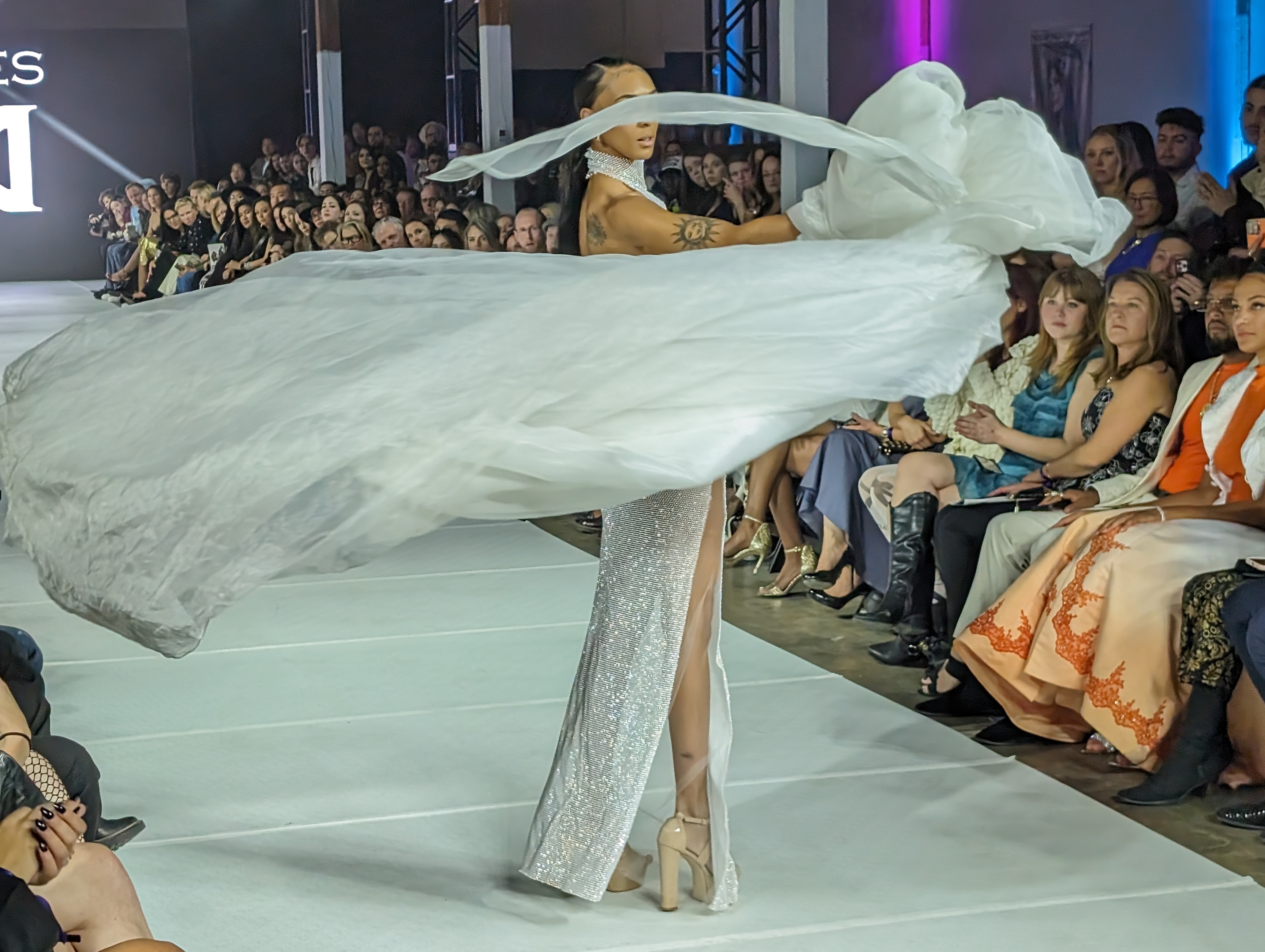 A swirl, leaving fabric flowing through the runway air as Narces, a luxury fashion design brand based out of Canada. The creator, Nikki Wirthensohn Yassemi, has a background in culture from Austria, Iran, the United Kingdom and Canada, using the collection of influences to create high-end evening wear and bridal dresses. (SageKelleyJefferson County Reportersage.kelley@denvergazette.comhttps://denvergazette.com/content/tncms/avatars/e/5f/457/e5f45740-2717-11ee-85b2-ab80f2d36252.5b966c1d2ce4987987665d57c237eda4.png)