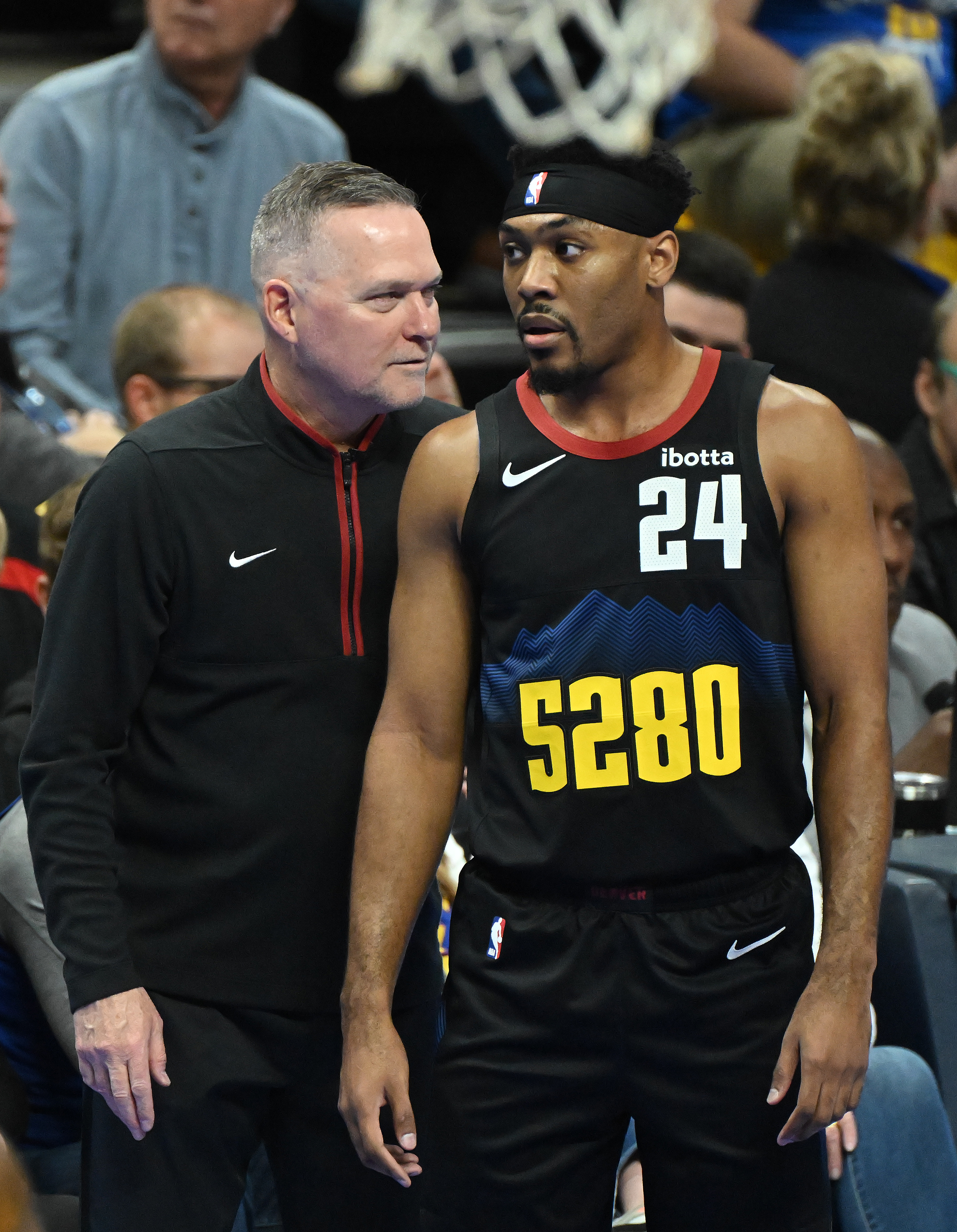 Nuggets Head Coach Michael Malone chats with Jalen Pickett on the sidelines during a game at Ball Arena on Tuesday, Nov. 14, 2023. The Nuggets handed the Clippers a defeat 111-108. (Photo by Jerilee Bennett, The Gazette)