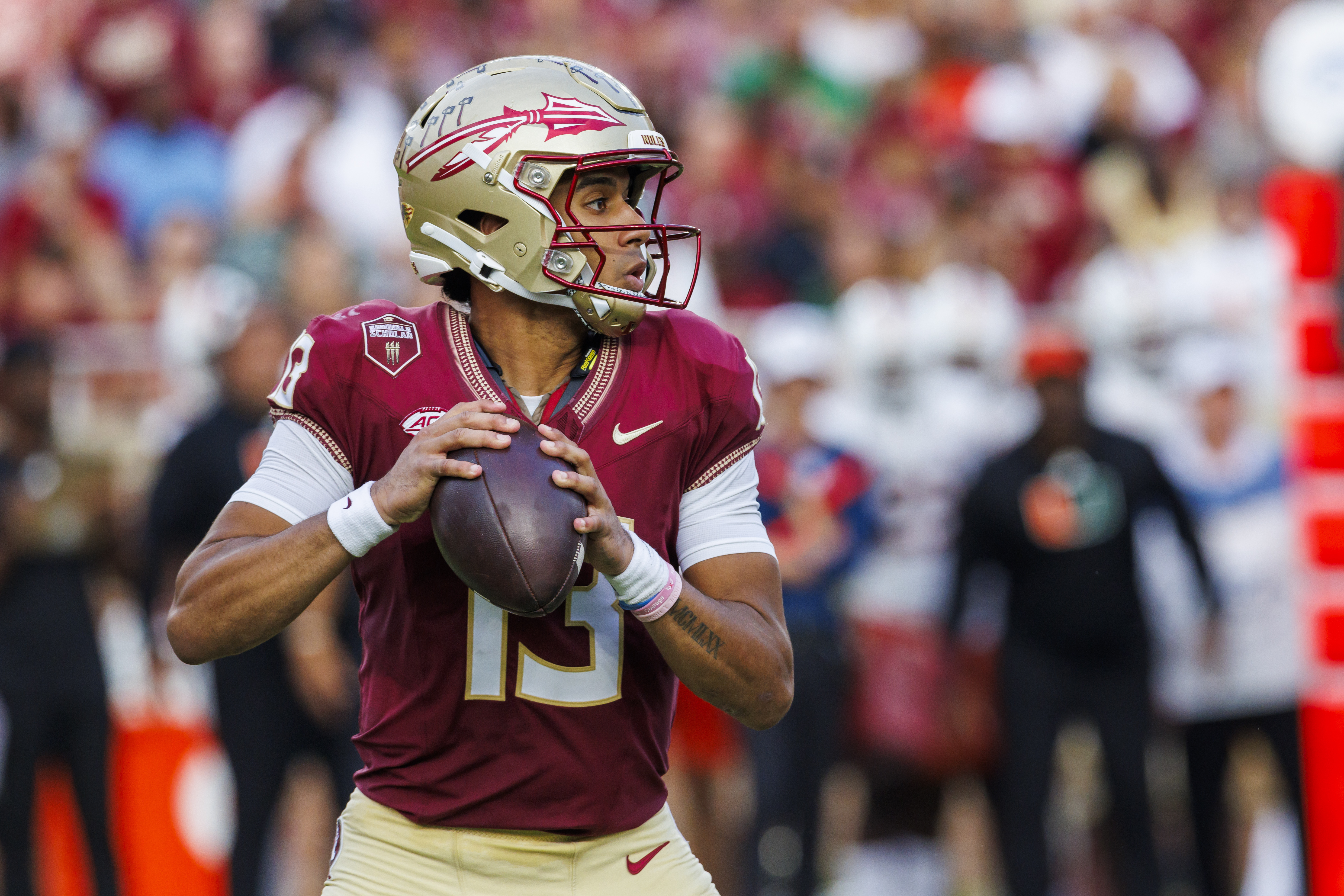 Florida State quarterback Jordan Travis looks for a receiver during the first half of an NCAA college football game against Miami, Saturday, Nov. 11, 2023, in Tallahassee, Fla. (AP Photo/Colin Hackley) (Colin Hackley)