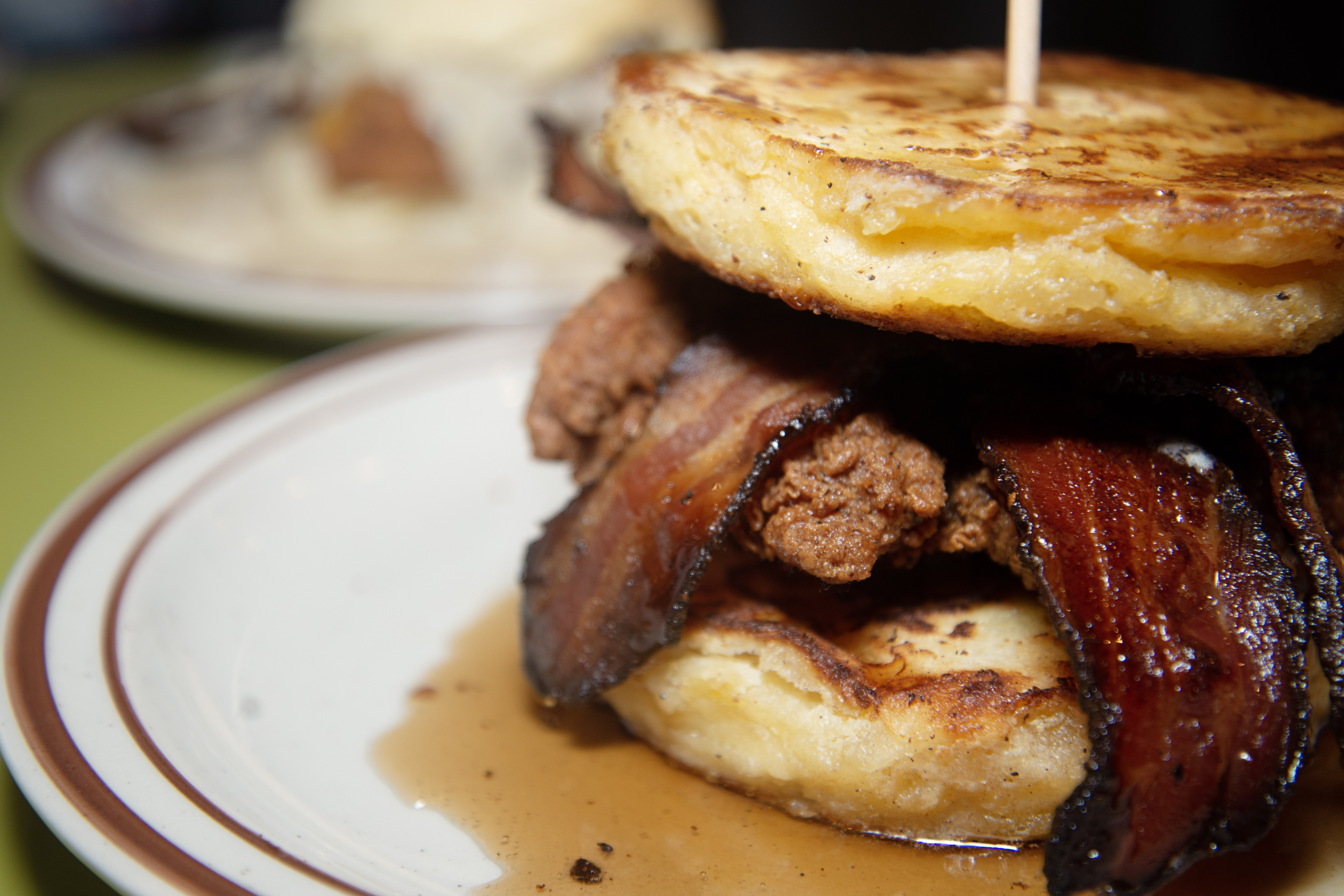 The LoLa Biscuit, right, has buttermilk fried chicken, bacon, house-made honey butter biscuit covered in maple syrup. (TomHellauerMultimedia Producertom.hellauer@denvergazette.comhttps://denvergazette.com/content/tncms/avatars/f/9e/622/f9e6228a-3b6b-11ed-bf10-fbb71fa8e421.f54b911252c540f1d61709edc4727a39.png)