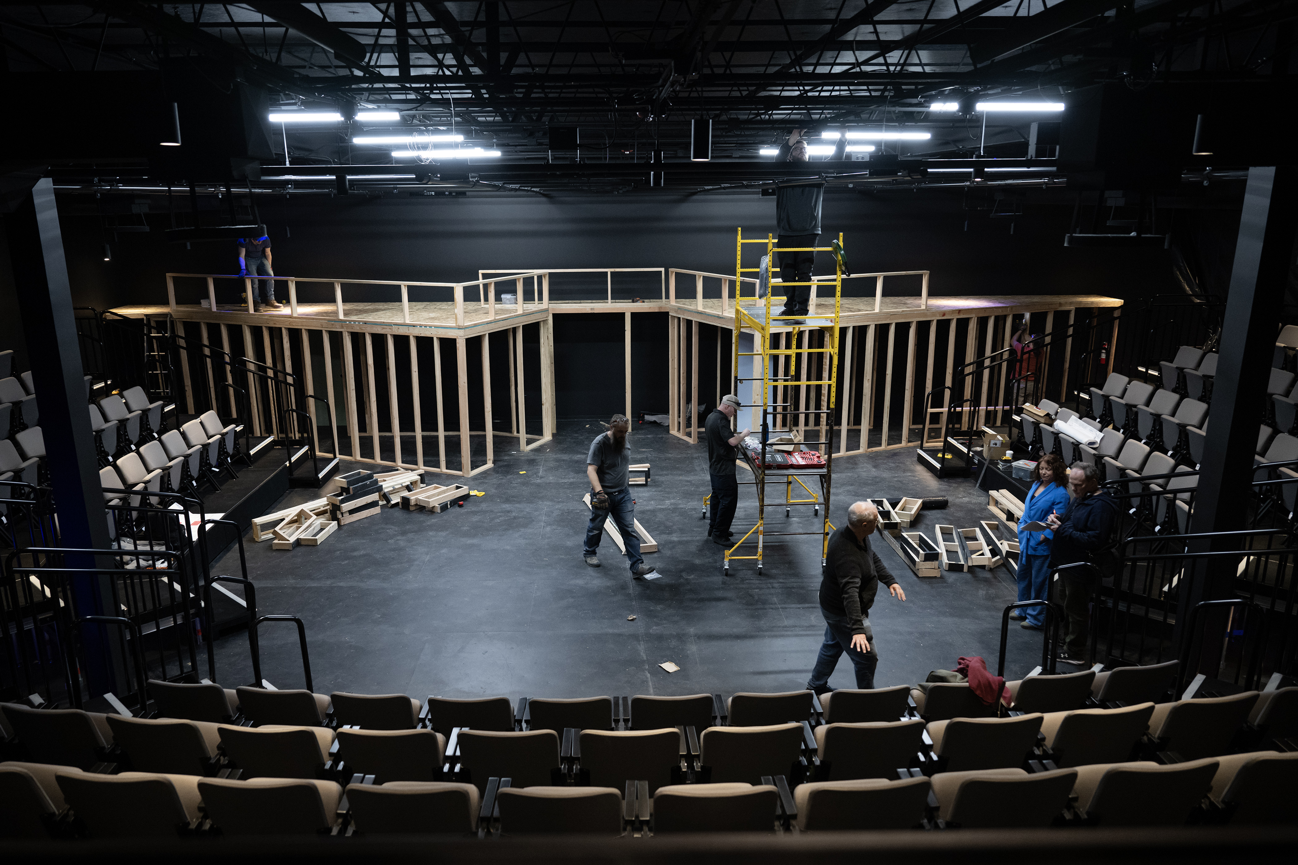 Crew members build the set for