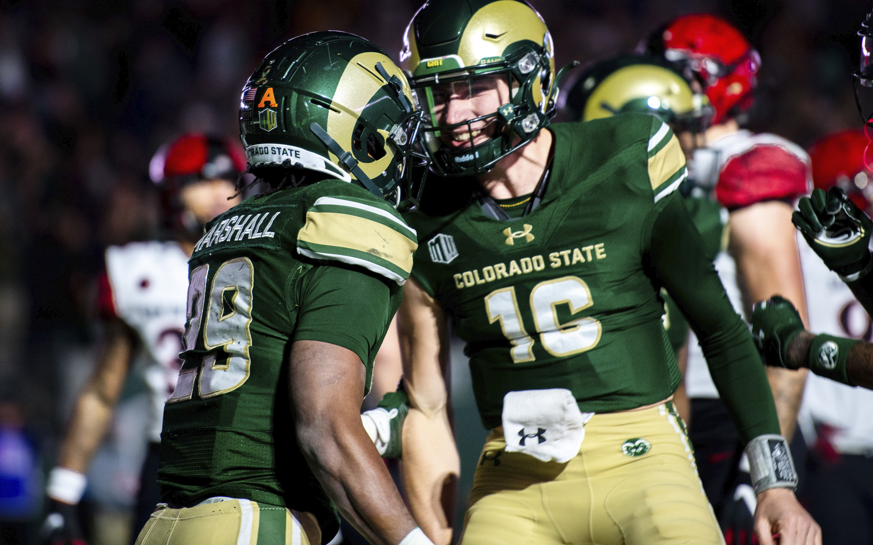 Colorado State running back Justin Marshall, left, is congratulated by quarterback Brayden Fowler-Nicolosi after a touchdown against San Diego State during an NCAA college football game Saturday, Nov. 11, 2023, in Fort Collins, Colo. (Cris Tiller/The Coloradoan via AP) (Cris Tiller)