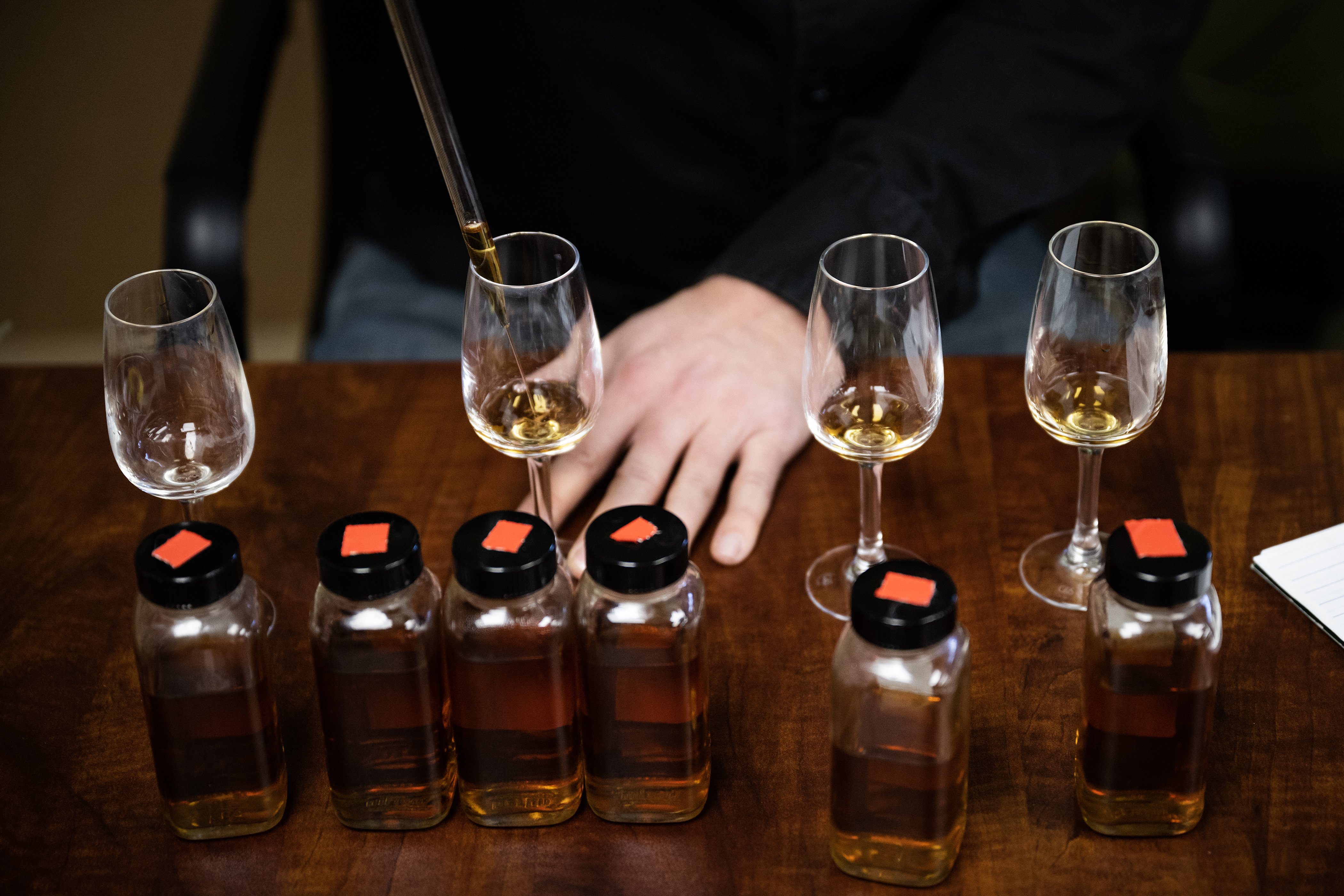 Stranahan's Whiskey Distillery head blender Justin Aden drops a precise amount of whiskey into a glass while blending and taking notes in his office on Thursday, Nov. 9, 2023, in Denver, Colo. (Timothy Hurst/Denver Gazette) (TimHursttim.hurst@gazette.comhttps://secure.gravatar.com/avatar/aca82bd62b4ee425c598527cd6faa1b1?d=mm&r=g)